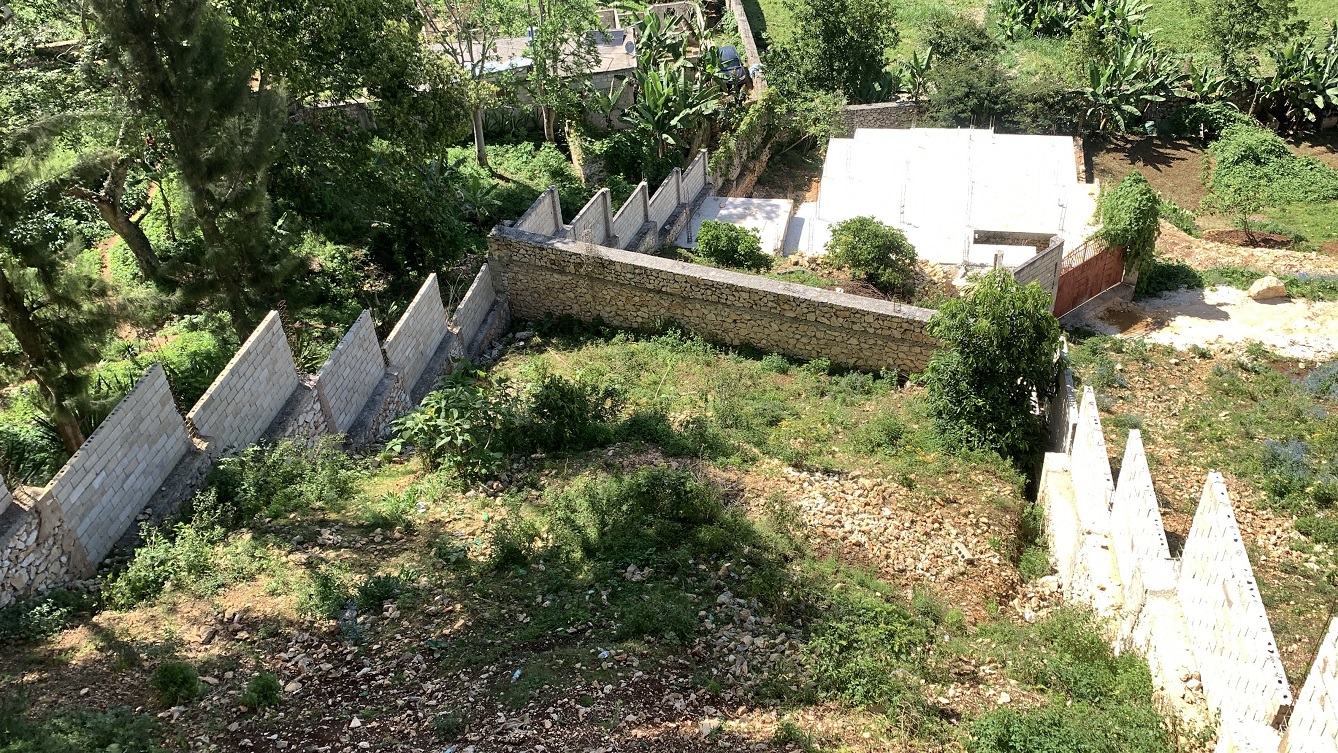 Unfinished MEGA House + Independent Fenced Land for Sale in Fermathe 45, Kenscoff, Haiti – 3-Story Mansion has 3 Floors with 8 Spacious Bedrooms, 7 Bathrooms, 3 Living/Dining Rooms, 2 Kitchens, Servant Quarter, Multiple Balconies, Back/Side Yards for Swimming Pool or Build on Roof-Top, Play Areas, 3 Gardens, Completely Fenced, Gated – Exclusive Neighborhood, 100% Residential Community with Breathtaking Panoramic View of Mountains, Cities, and the Caribbean Turquoise Blue Sea/Ocean