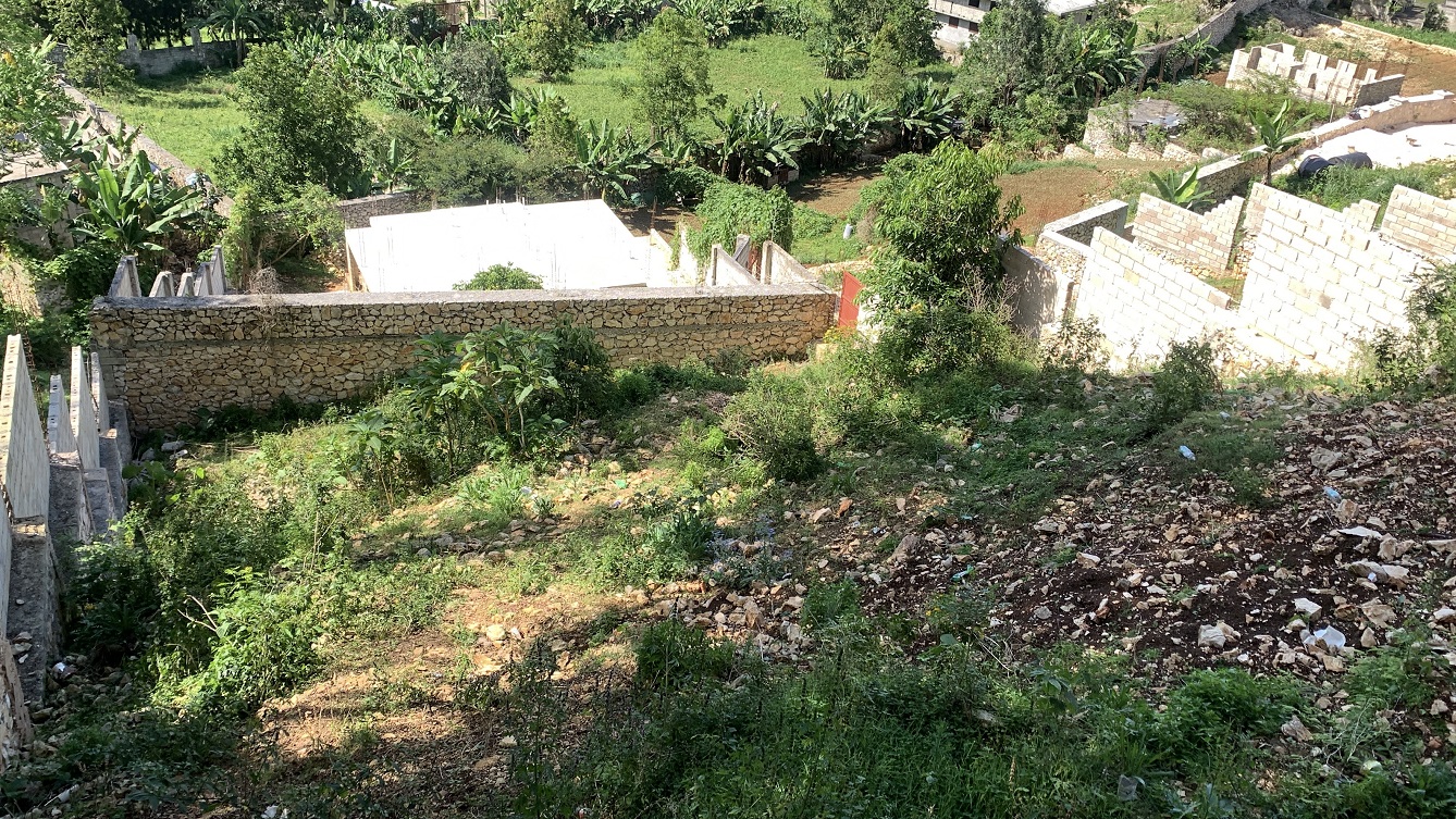 Unfinished MEGA House + Independent Fenced Land for Sale in Fermathe 45, Kenscoff, Haiti – 3-Story Mansion has 3 Floors with 8 Spacious Bedrooms, 7 Bathrooms, 3 Living/Dining Rooms, 2 Kitchens, Servant Quarter, Multiple Balconies, Back/Side Yards for Swimming Pool or Build on Roof-Top, Play Areas, 3 Gardens, Completely Fenced, Gated – Exclusive Neighborhood, 100% Residential Community with Breathtaking Panoramic View of Mountains, Cities, and the Caribbean Turquoise Blue Sea/Ocean
