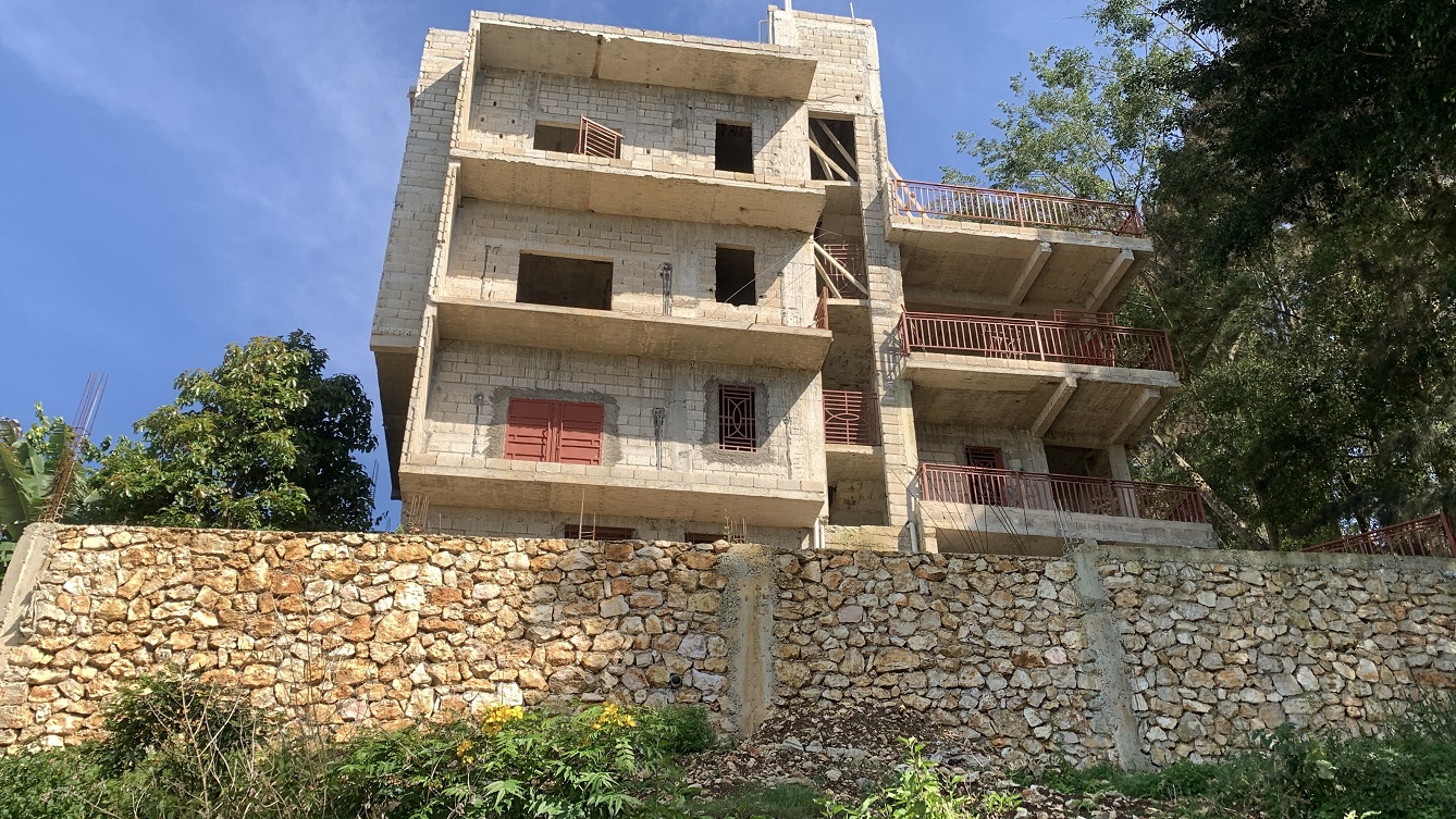 Unfinished MEGA House + Independent Fenced Land for Sale in Fermathe 45, Kenscoff, Haiti – 3-Story Mansion has 3 Floors with 8 Spacious Bedrooms, 7 Bathrooms, 3 Living/Dining Rooms, 2 Kitchens, Servant Quarter, Multiple Balconies, Back/Side Yards for Swimming Pool or Build on Roof-Top, Play Areas, 3 Gardens, Completely Fenced, Gated – Exclusive Neighborhood, 100% Residential Community with Breathtaking Panoramic View of Mountains, Cities, and the Caribbean Turquoise Blue Sea/Ocean