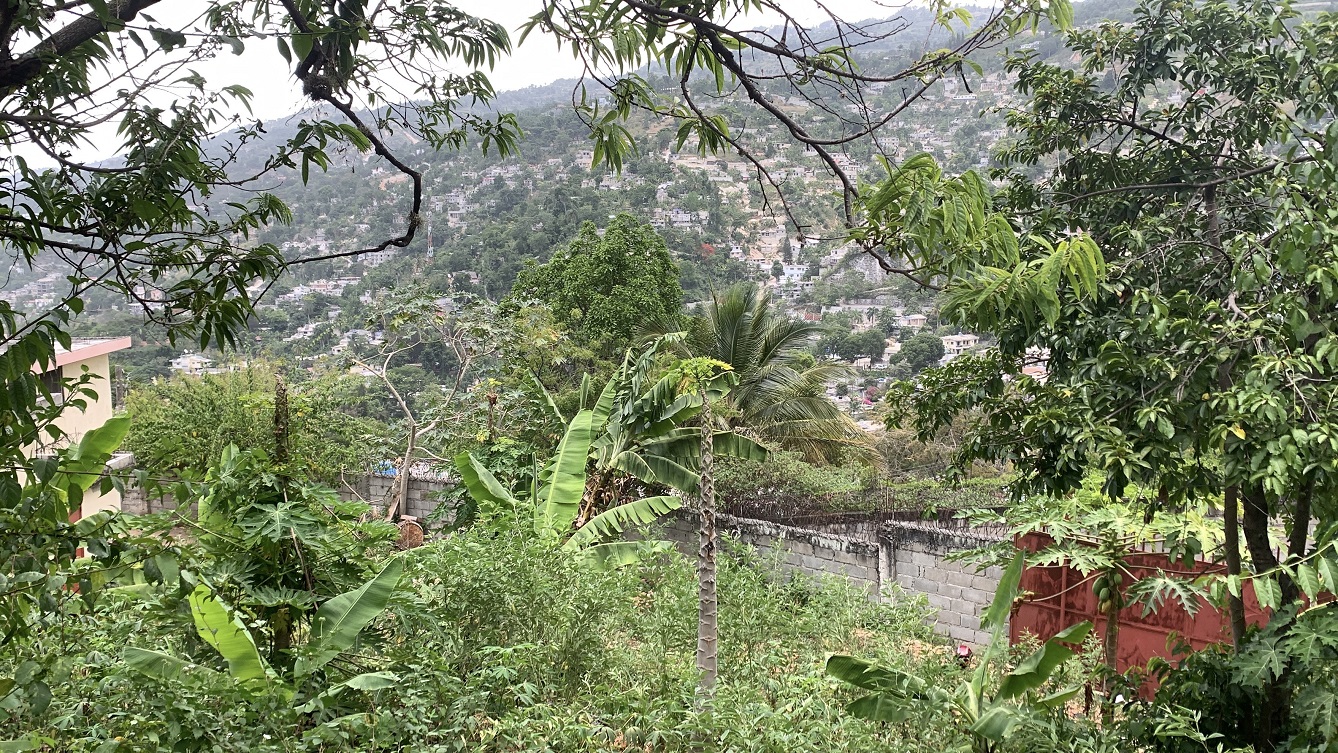 Premium Residential Land + Small 2-Bedroom , 1 Bath House for Sale in Pelerin 6 & 4 Petion-Ville, Haiti – 8 Centiemes (1,032m², 11,108ft², or 0.25 Acres) with Nicely Paved Roads, 100% Suburban Neighborhood, Highly Secure with Private Security Force, Flat, Build-Ready, 3-Way Fenced, Gated – Expensive Luxury Houses,  Apartment Complexes, Embassies, and Ambassadors in Area