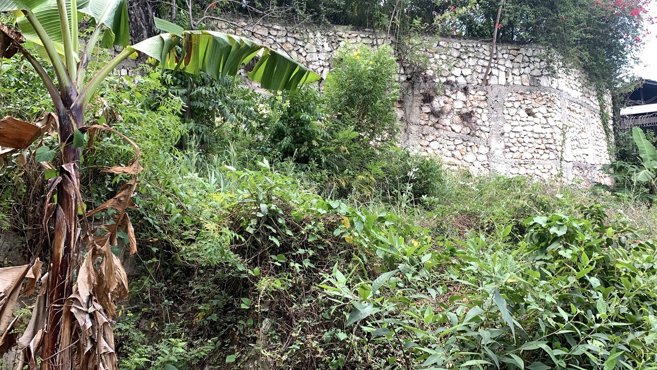 Premium Residential Land + Small 2-Bedroom , 1 Bath House for Sale in Pelerin 6 & 4 Petion-Ville, Haiti – 8 Centiemes (1,032m², 11,108ft², or 0.25 Acres) with Nicely Paved Roads, 100% Suburban Neighborhood, Highly Secure with Private Security Force, Flat, Build-Ready, 3-Way Fenced, Gated – Expensive Luxury Houses,  Apartment Complexes, Embassies, and Ambassadors in Area