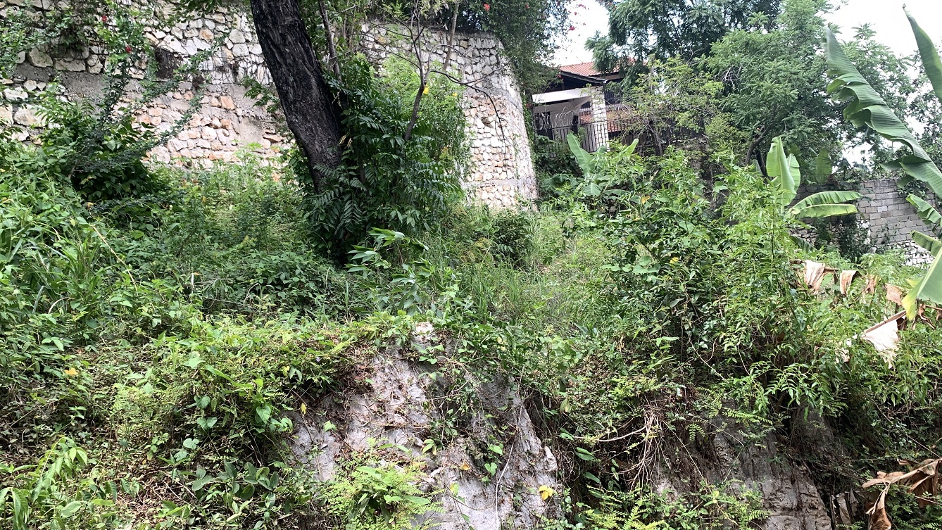 Premium Residential Land + Small 2-Bedroom , 1 Bath House for Sale in Pelerin 6 & 4 Petion-Ville, Haiti – 8 Centiemes (1,032m², 11,108ft², or 0.25 Acres) with Nicely Paved Roads, 100% Suburban Neighborhood, Highly Secure with Private Security Force, Flat, Build-Ready, 3-Way Fenced, Gated – Expensive Luxury Houses,  Apartment Complexes, Embassies, and Ambassadors in Area
