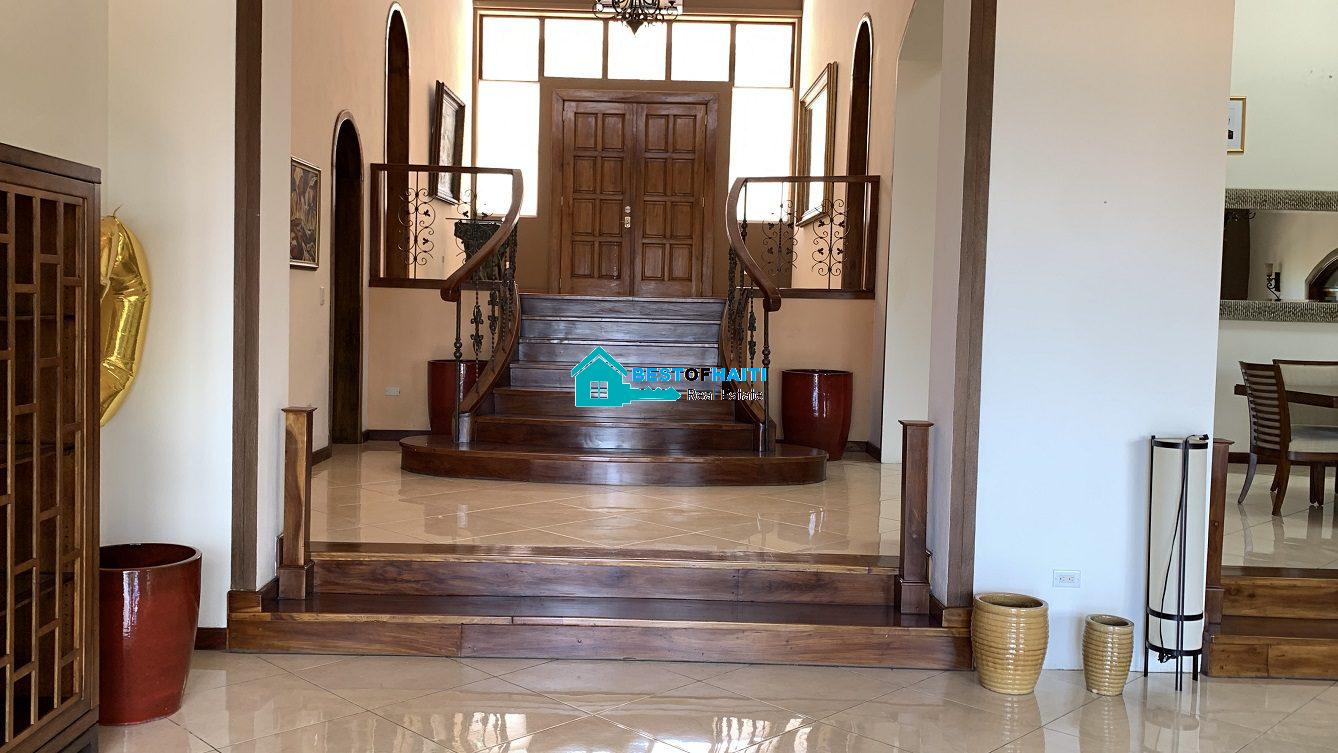 Luxury Fully Furnished Mansion for Rent in the Montana Hotel area of Petion-Ville, Haiti – 5 Spacious Bedrooms, 6 Bathrooms, Sparkling Swimming Pool, Jacuzzi, Whirlpool Jacuzzi Tubs, Air-Conditioner Units (A/C), Ceiling Fans, Washer/Dryer, Breathtaking Views, Strong Solar-Powered Electricity System, Bulletproof Doors/Windowns, Parking for 10 Cars, Servant Quarter, Round-the-Clock Armed Security Guards, Elicopter Landing Pad & More…