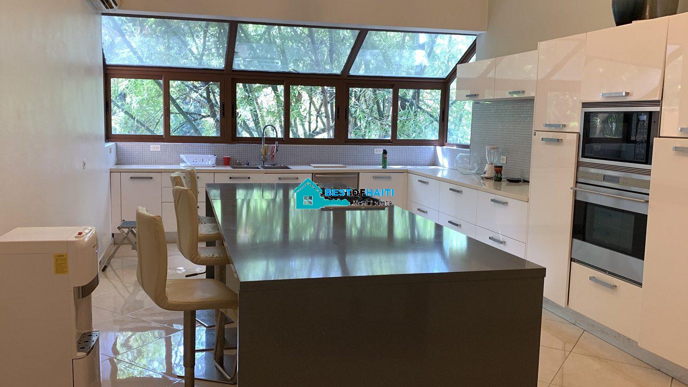 Luxury Fully Furnished Mansion for Rent in the Montana Hotel area of Petion-Ville, Haiti – 5 Spacious Bedrooms, 6 Bathrooms, Sparkling Swimming Pool, Jacuzzi, Whirlpool Jacuzzi Tubs, Air-Conditioner Units (A/C), Ceiling Fans, Washer/Dryer, Breathtaking Views, Strong Solar-Powered Electricity System, Bulletproof Doors/Windowns, Parking for 10 Cars, Servant Quarter, Round-the-Clock Armed Security Guards, Elicopter Landing Pad & More…