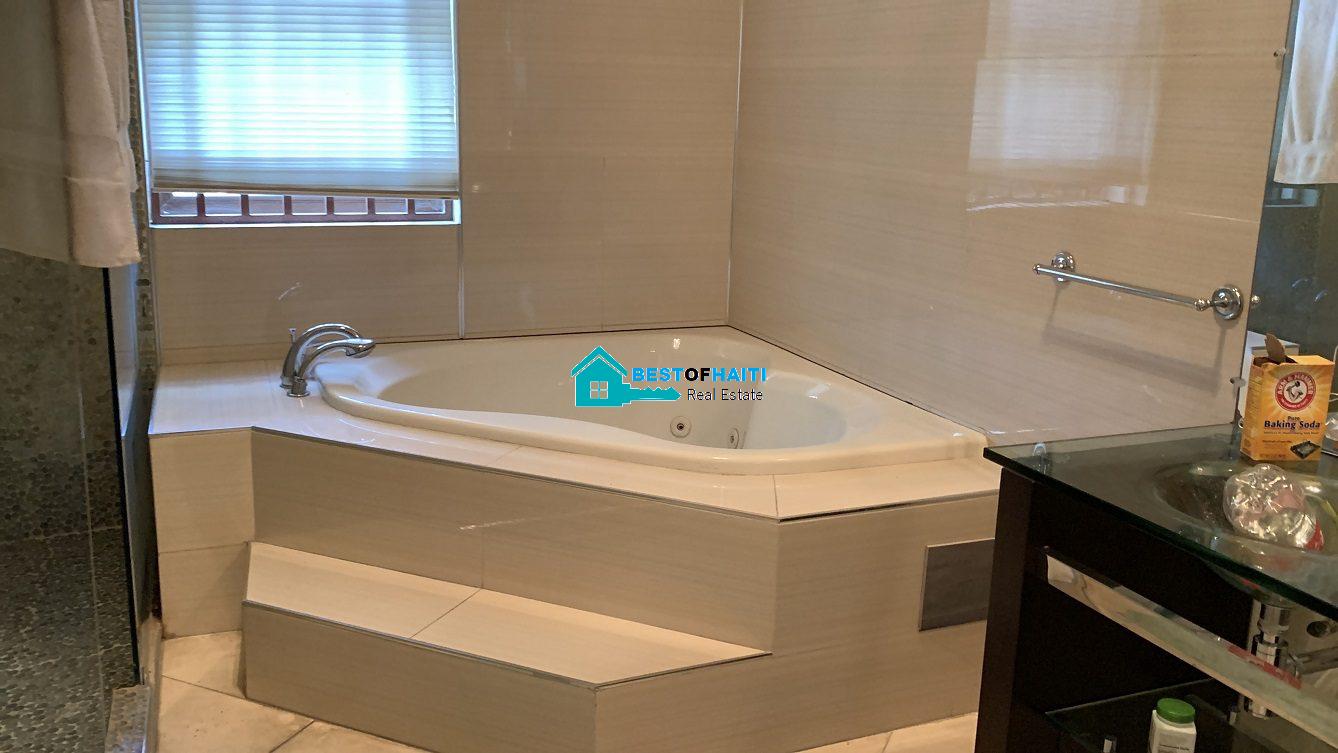 Luxury Fully Furnished Mansion for Rent in the Montana Hotel area of Petion-Ville, Haiti – 5 Spacious Bedrooms, 6 Bathrooms, Sparkling Swimming Pool, Jacuzzi, Whirlpool Jacuzzi Tubs, Air-Conditioner Units (A/C), Ceiling Fans, Washer/Dryer, Breathtaking Views, Strong Solar-Powered Electricity System, Bulletproof Doors/Windowns, Parking for 10 Cars, Servant Quarter, Round-the-Clock Armed Security Guards, Elicopter Landing Pad & More…