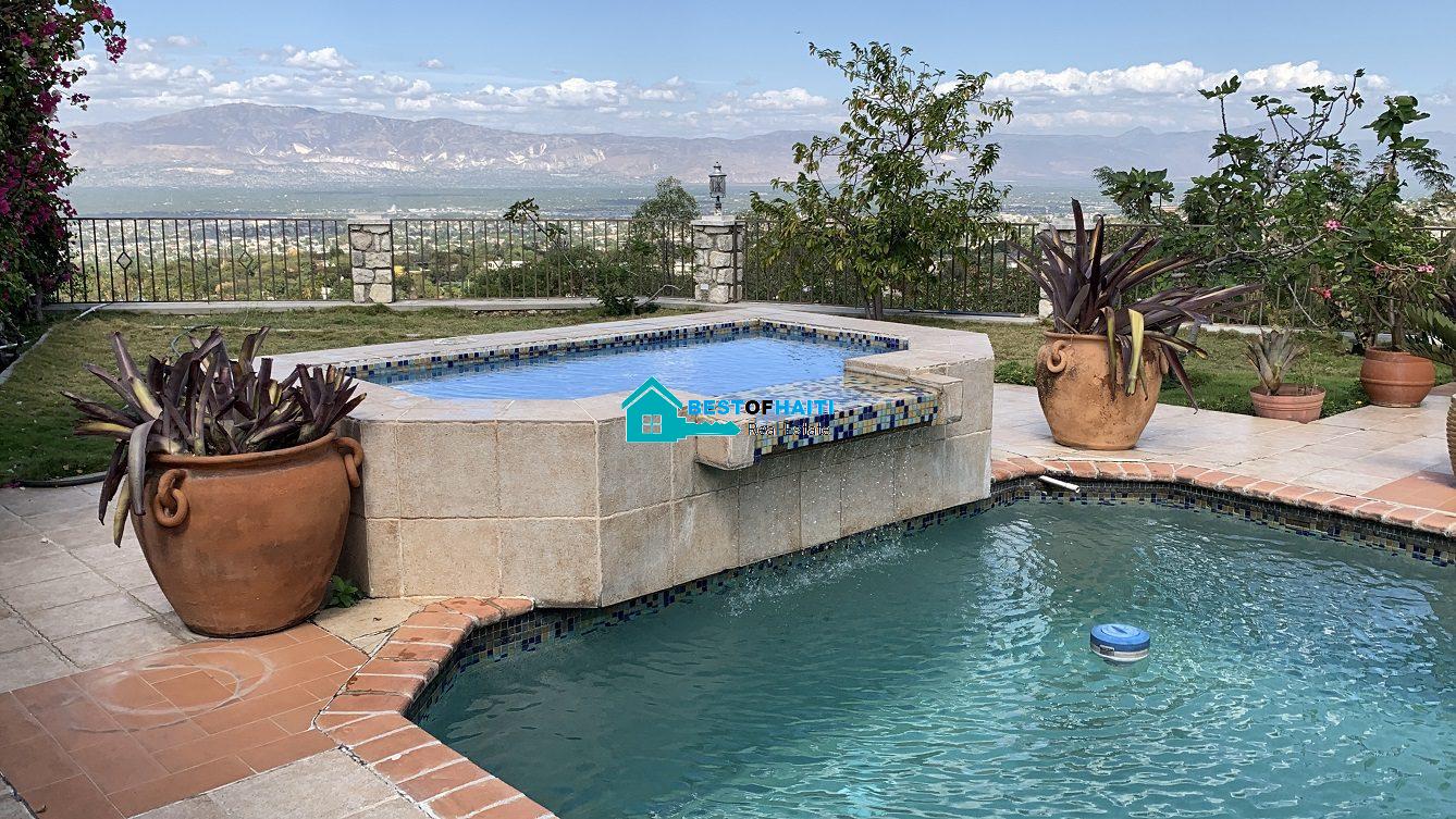 Luxury Fully Furnished Mansion for Rent in the Montana Hotel area of Petion-Ville, Haiti – 5 Spacious Bedrooms, 6 Bathrooms, Sparkling Swimming Pool, Jacuzzi, Whirlpool Jacuzzi Tubs, Air-Conditioner Units (A/C), Ceiling Fans, Washer/Dryer, Breathtaking Views, Strong Solar-Powered Electricity System, Bulletproof Doors/Windowns, Parking for 10 Cars, Servant Quarter, Round-the-Clock Armed Security Guards, Elicopter Landing Pad & More…