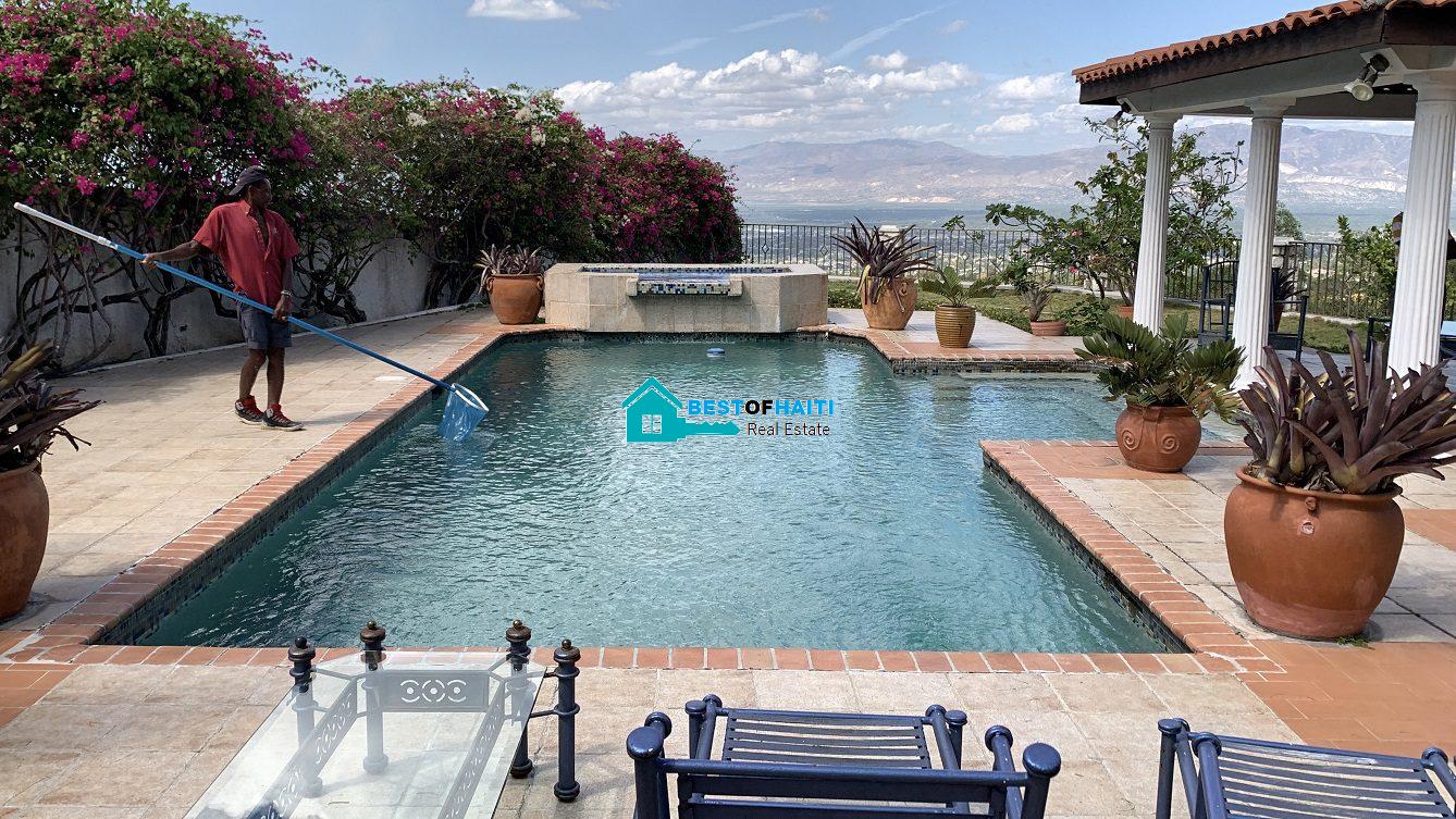 Luxury Fully Furnished Mansion for Rent in the Montana Hotel area of Petion-Ville, Haiti – 5 Spacious Bedrooms, 6 Bathrooms, Sparkling Swimming Pool, Jacuzzi, Whirlpool Jacuzzi Tubs, Air-Conditioner Units (A/C), Ceiling Fans, Washer/Dryer, Breathtaking Views, Strong Solar-Powered Electricity System, Bulletproof Doors/Windowns, Parking for 10 Cars, Servant Quarter, Round-the-Clock Armed Security Guards, Elicopter Landing Pad & More…