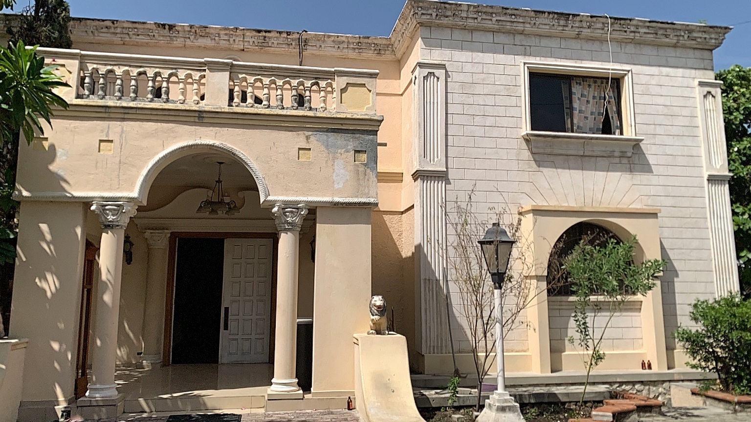 Palace-Style Villa for Sale, Vivy Mitchell, Petion-Ville, Haiti – House or Home has 6 Spacious Bedrooms, 5 1/2 Bathrooms, Multiple Grand Living & Dining Rooms, Majestic Kitchen, Whirlpool Jacuzzi Tub in Master Bedroom, Walk-in Closet, Basement Game Room & Gym, Floor-to-Ceiling Windows, Big Balconies, Terrace & Decks, Indoor & Outdoor Seating Areas, Ample Front-Back Yard Space, Reserved Space for Swimming Pool, Fruits, Vegetables, Tropical Trees, Two Gates, Brick Fence, Parking for 13+ Cars