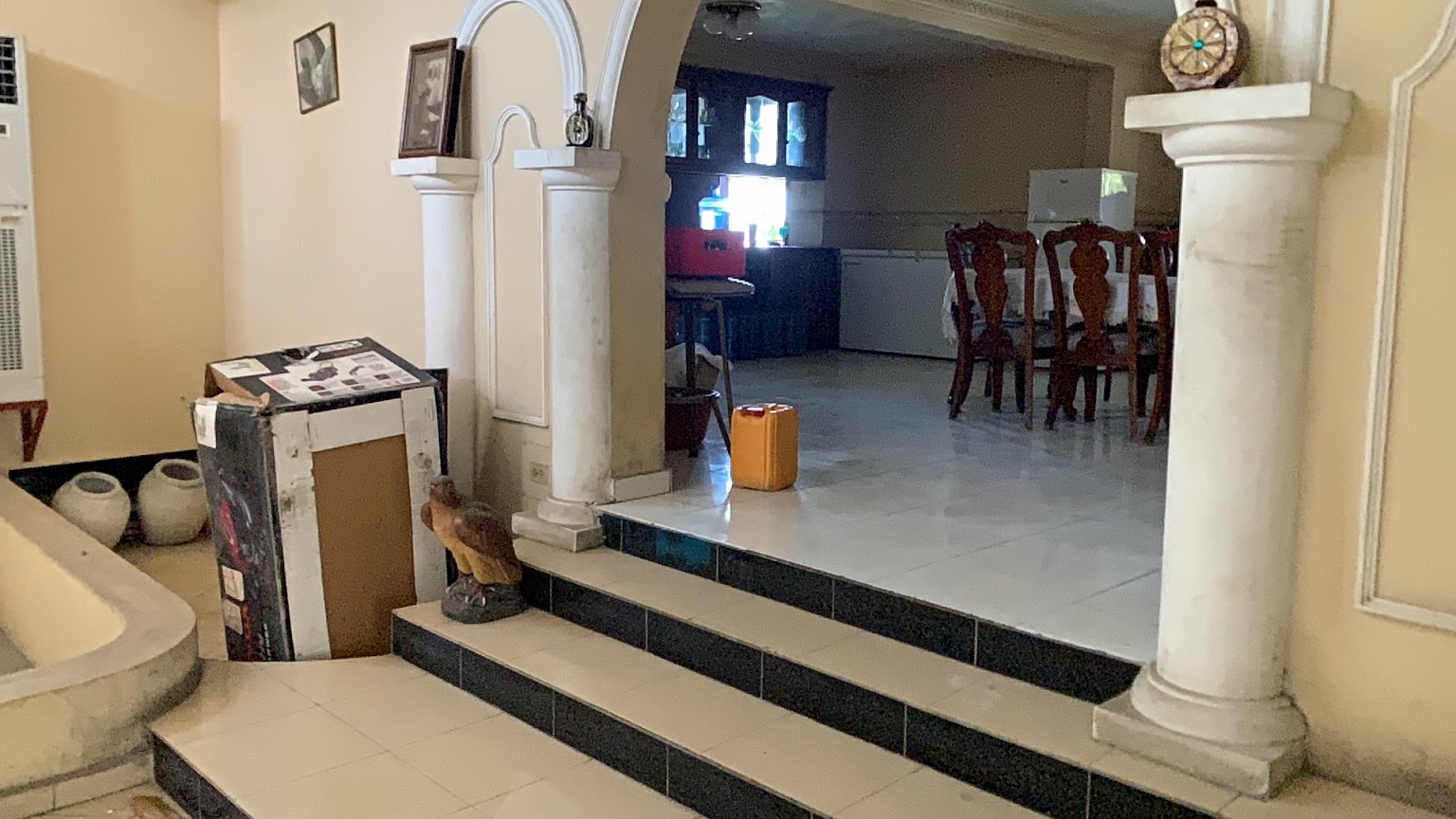 Palace-Style Villa for Sale, Vivy Mitchell, Petion-Ville, Haiti – House or Home has 6 Spacious Bedrooms, 5 1/2 Bathrooms, Multiple Grand Living & Dining Rooms, Majestic Kitchen, Whirlpool Jacuzzi Tub in Master Bedroom, Walk-in Closet, Basement Game Room & Gym, Floor-to-Ceiling Windows, Big Balconies, Terrace & Decks, Indoor & Outdoor Seating Areas, Ample Front-Back Yard Space, Reserved Space for Swimming Pool, Fruits, Vegetables, Tropical Trees, Two Gates, Brick Fence, Parking for 13+ Cars