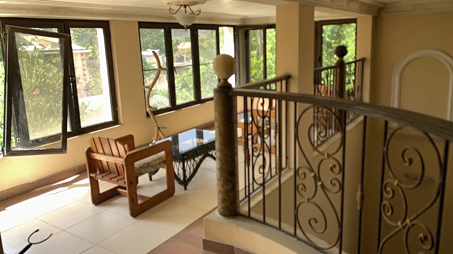 Palace-Style Villa for Sale, Vivy Mitchell, Petion-Ville, Haiti – House or Home has 6 Spacious Bedrooms, 5 1/2 Bathrooms, Multiple Grand Living & Dining Rooms, Majestic Kitchen, Whirlpool Jacuzzi Tub in Master Bedroom, Walk-in Closet, Basement Game Room & Gym, Floor-to-Ceiling Windows, Big Balconies, Terrace & Decks, Indoor & Outdoor Seating Areas, Ample Front-Back Yard Space, Reserved Space for Swimming Pool, Fruits, Vegetables, Tropical Trees, Two Gates, Brick Fence, Parking for 13+ Cars