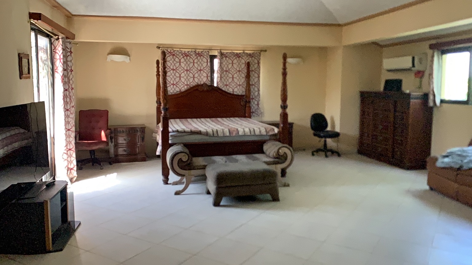 Palace-Style Villa for Sale, Vivy Mitchell, Petion-Ville, Haiti – House or Home has 6 Spacious Bedrooms, 5 1/2 Bathrooms, Multiple Grand Living & Dining Rooms, Majestic Kitchen, Whirlpool Jacuzzi Tub in Master Bedroom, Walk-in Closet, Basement Game Room & Gym, Floor-to-Ceiling Windows, Big Balconies, Terrace & Decks, Indoor & Outdoor Seating Areas, Ample Front-Back Yard Space, Reserved Space for Swimming Pool, Fruits, Vegetables, Tropical Trees, Two Gates, Brick Fence, Parking for 13+ Cars