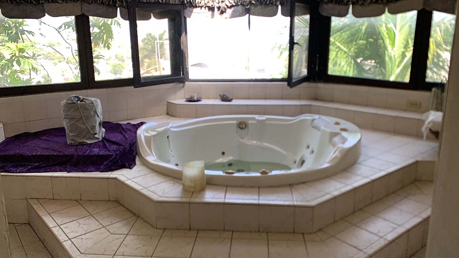 Palace-Style Villa for Sale, Vivy Mitchell, Petion-Ville, Haiti – House or Home has 6 Spacious Bedrooms, 5 1/2 Bathrooms, Multiple Grand Living & Dining Rooms, Majestic Kitchen, Whirlpool Jacuzzi Tub in Master Bedroom, Walk-in Closet, Basement Game Room & Gym, Floor-to-Ceiling Windows, Big Balconies, Terrace & Decks, Indoor & Outdoor Seating Areas, Ample Front-Back Yard Space, Reserved Space for Swimming Pool, Fruits, Vegetables, Tropical Trees, Two Gates, Brick Fence, Parking for 13+ Cars