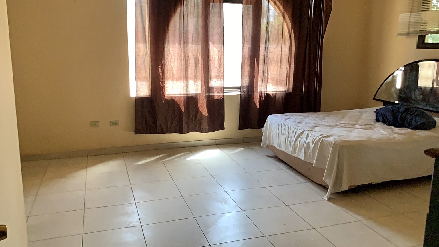 Palace-Style Villa for Sale, Vivy Mitchell, Petion-Ville, Haiti – House or Home has 6 Spacious Bedrooms, 5 1/2 Bathrooms, Multiple Grand Living & Dining Rooms, Majestic Kitchen, Whirlpool Jacuzzi Tub in Master Bedroom, Walk-in Closet, Basement Game Room & Gym, Floor-to-Ceiling Windows, Big Balconies, Terrace & Decks, Indoor & Outdoor Seating Areas, Ample Front-Back Yard Space, Reserved Space for Swimming Pool, Fruits, Vegetables, Tropical Trees, Two Gates, Brick Fence, Parking for 13+ Cars