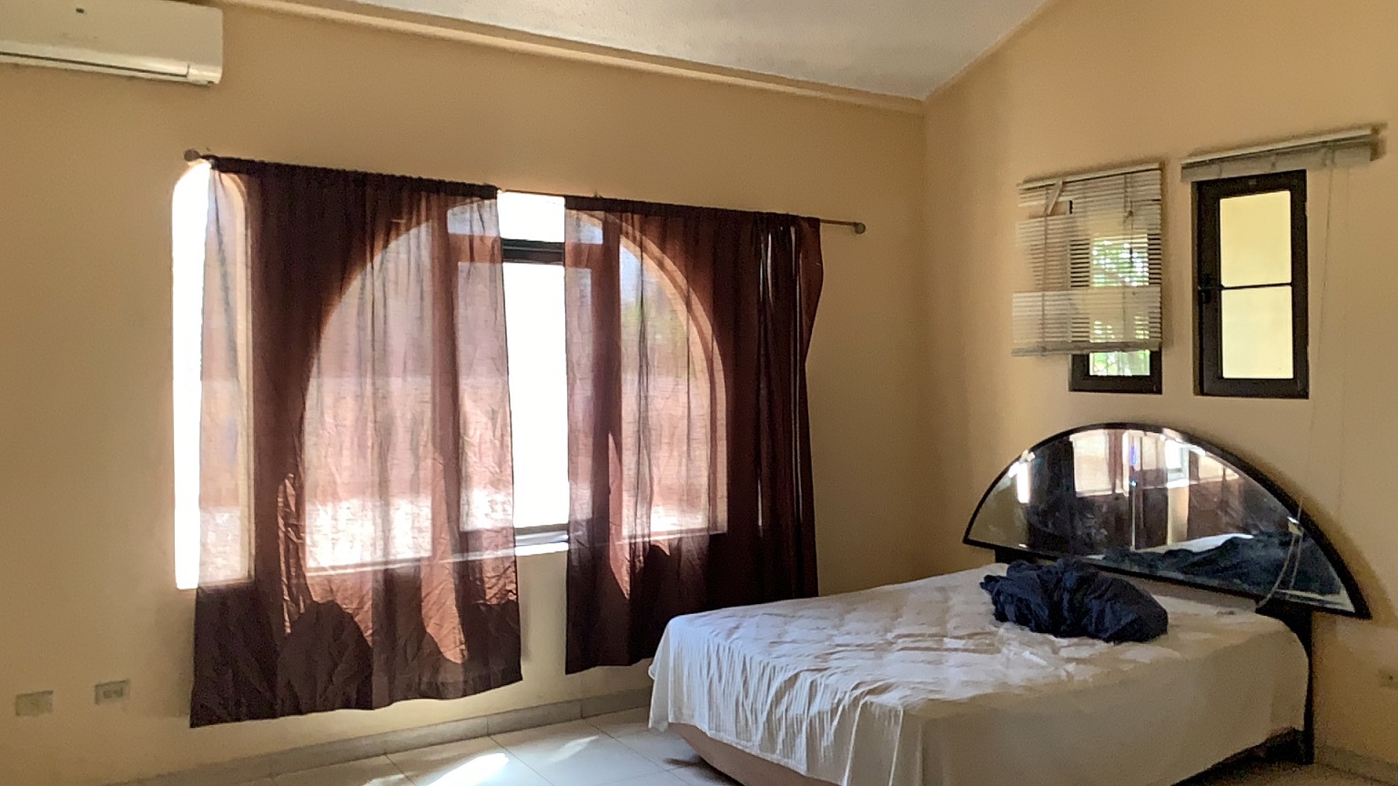 Palace-Style Villa for Sale, Vivy Mitchell, Petion-Ville, Haiti – House or Home has 6 Spacious Bedrooms, 5 1/2 Bathrooms, Multiple Grand Living & Dining Rooms, Majestic Kitchen, Whirlpool Jacuzzi Tub in Master Bedroom, Walk-in Closet, Basement Game Room & Gym, Floor-to-Ceiling Windows, Big Balconies, Terrace & Decks, Indoor & Outdoor Seating Areas, Ample Front-Back Yard Space, Reserved Space for Swimming Pool, Fruits, Vegetables, Tropical Trees, Two Gates, Brick Fence, Parking for 13+ Cars