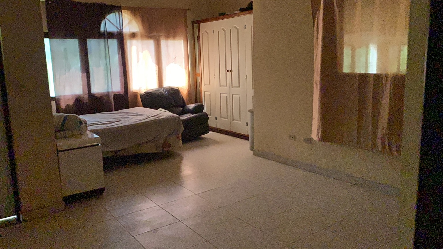 Palace-Style Villa for Sale, Vivy Mitchell, Petion-Ville, Haiti – House or Home has 6 Spacious Bedrooms, 5 1/2 Bathrooms, Multiple Grand Living & Dining Rooms, Majestic Kitchen, Whirlpool Jacuzzi Tub in Master Bedroom, Walk-in Closet, Basement Game Room & Gym, Floor-to-Ceiling Windows, Big Balconies, Terrace & Decks, Indoor & Outdoor Seating Areas, Ample Front-Back Yard Space, Reserved Space for Swimming Pool, Fruits, Vegetables, Tropical Trees, Two Gates, Brick Fence, Parking for 13+ Cars