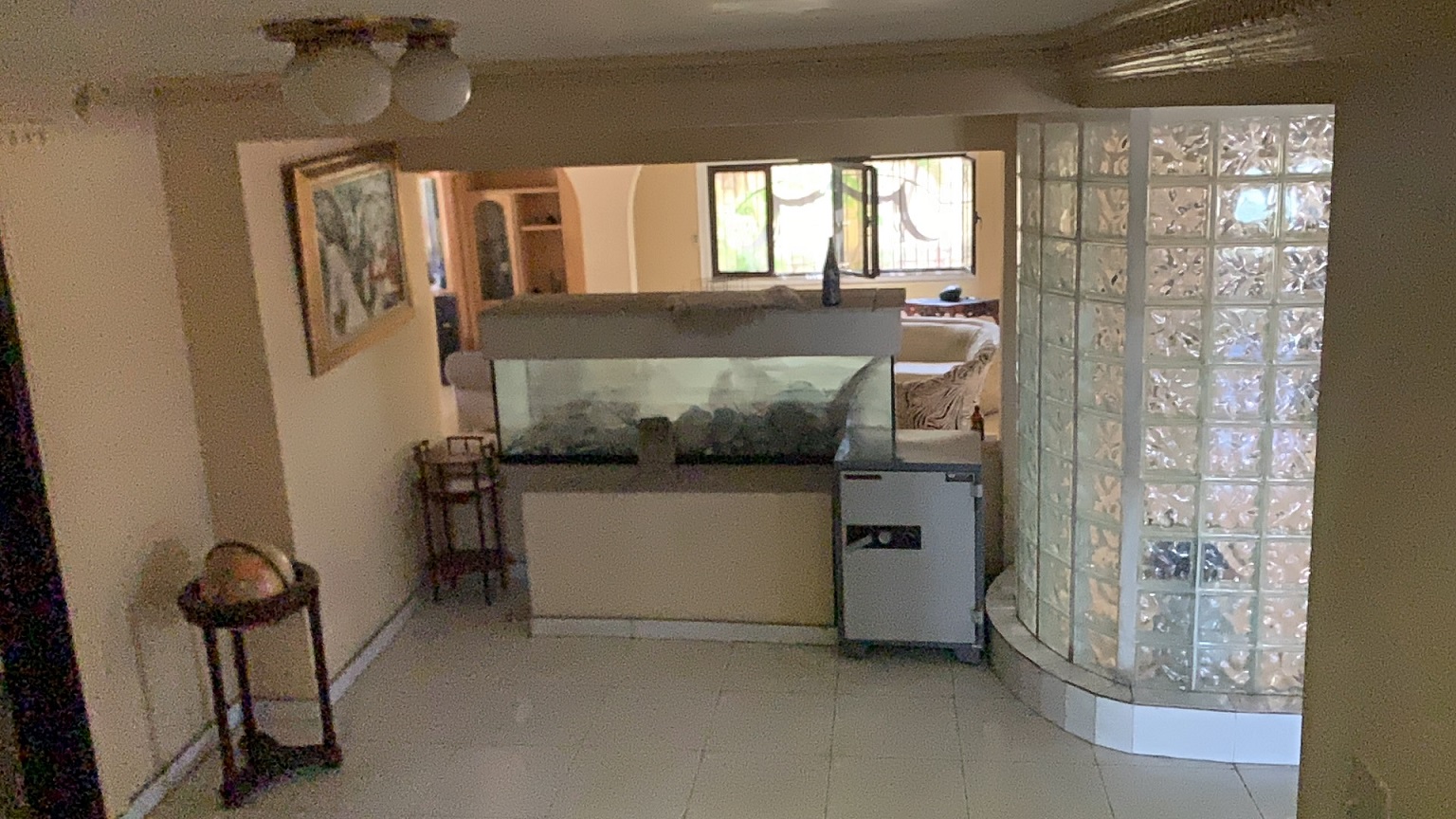 Palace-Style Villa for Sale, Vivy Mitchell, Petion-Ville, Haiti – House or Home has 6 Spacious Bedrooms, 5 1/2 Bathrooms, Multiple Grand Living & Dining Rooms, Majestic Kitchen, Whirlpool Jacuzzi Tub in Master Bedroom, Walk-in Closet, Basement Game Room & Gym, Floor-to-Ceiling Windows, Big Balconies, Terrace & Decks, Indoor & Outdoor Seating Areas, Ample Front-Back Yard Space, Reserved Space for Swimming Pool, Fruits, Vegetables, Tropical Trees, Two Gates, Brick Fence, Parking for 13+ Cars