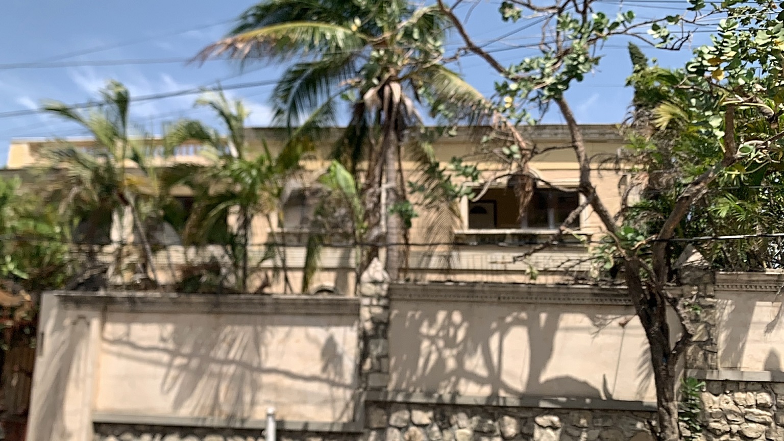 Palace-Style Villa for Sale, Vivy Mitchell, Petion-Ville, Haiti – House or Home has 6 Spacious Bedrooms, 5 1/2 Bathrooms, Multiple Grand Living & Dining Rooms, Majestic Kitchen, Whirlpool Jacuzzi Tub in Master Bedroom, Walk-in Closet, Basement Game Room & Gym, Floor-to-Ceiling Windows, Big Balconies, Terrace & Decks, Indoor & Outdoor Seating Areas, Ample Front-Back Yard Space, Reserved Space for Swimming Pool, Fruits, Vegetables, Tropical Trees, Two Gates, Brick Fence, Parking for 13+ Cars
