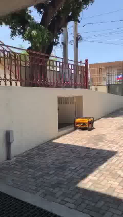 Huge Commercial Office Building for Sale in Turgeau, Port-au-Prince, Haiti – 1,000 m² of Office Space, 23+ Parking Spaces, Prefabricated Metal Complex (Florida Prefab), Bolted Structural Reinforcement, Certified Seismic-Resistant, Anti-cyclonic ASCE-705, 10-Foot-Tall Brick Wall/Fence, Massive Metal Gate, 23,000 Gallons Reservoir, Électricité d’Haïti (EDH), High-Speed Internet, DINEPA