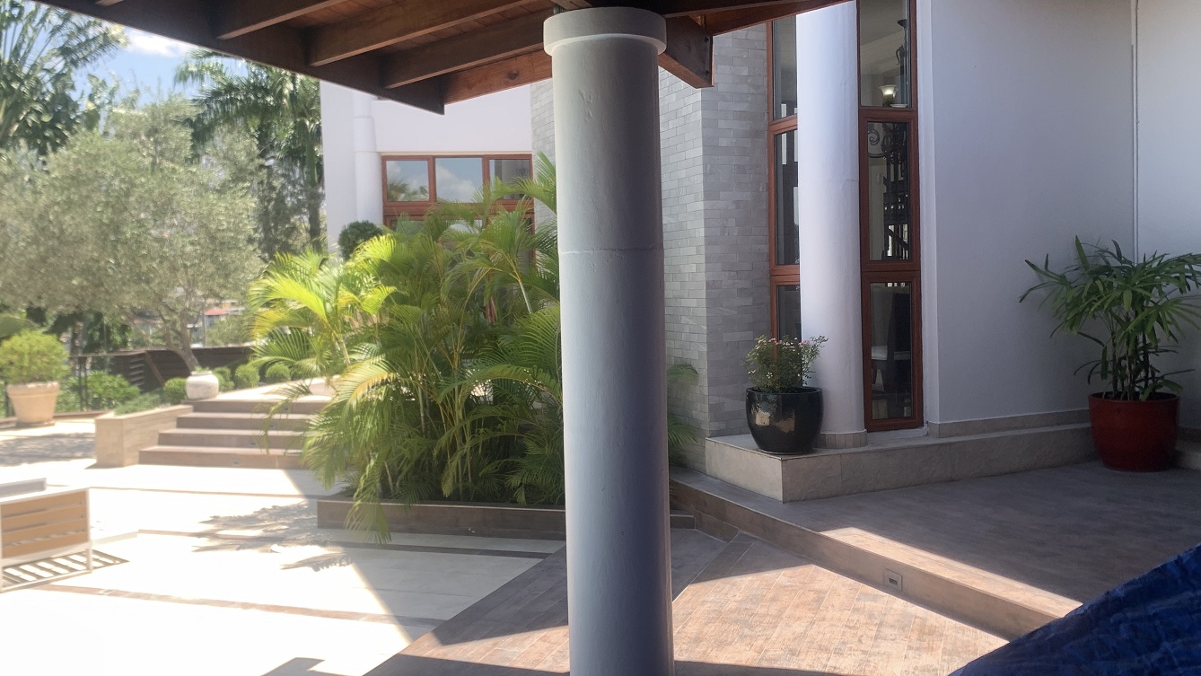 Lavish Furnished Paraseismic Mansion for Sale in Juvenat (Karibe Hotel Green Zone), Port-au-Prince, Haiti – 4 Spacious Bedrooms with Modern High-end Furniture & Appliances, Large Circular Living/Dining Rooms, 3 1/2 Stylish Bathrooms, Gourmet Kitchen, Panoramic Living/Dining Rooms, Gleaming Swimming Pool with Attached Jacuzzi, Multiple Seating Areas, Exclusive/Private Neighborhood, Robust 24/7 Solar-Powered Electricity System, Servant/Security Quarter