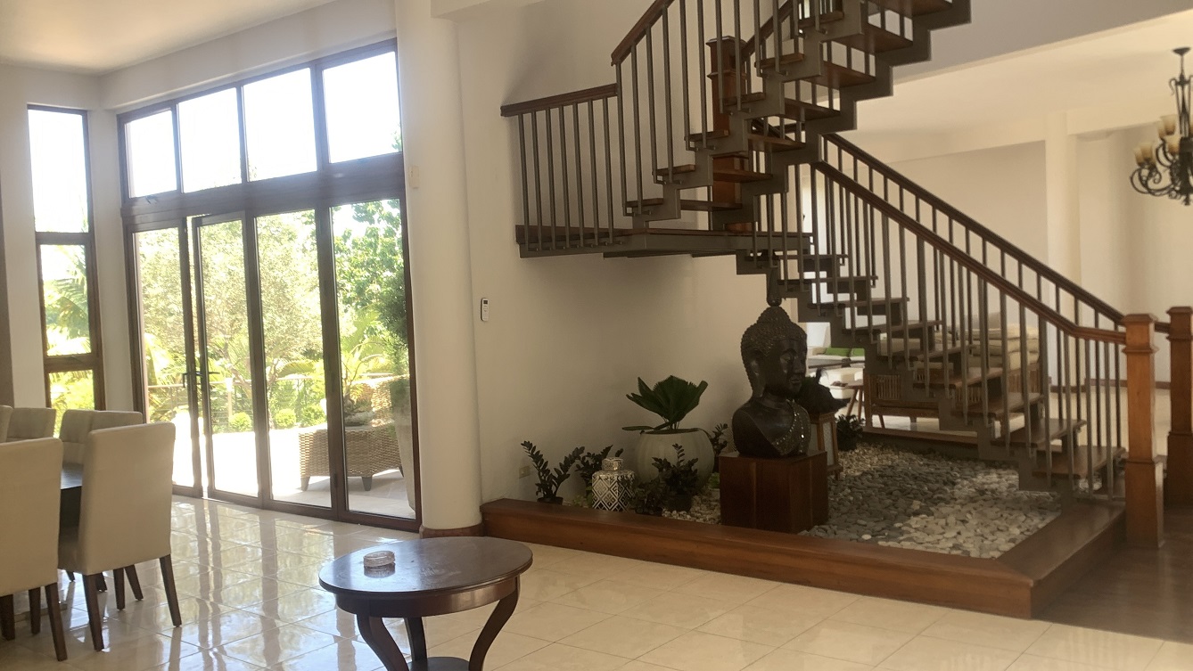 Lavish Furnished Paraseismic Mansion for Sale in Juvenat (Karibe Hotel Green Zone), Port-au-Prince, Haiti – 4 Spacious Bedrooms with Modern High-end Furniture & Appliances, Large Circular Living/Dining Rooms, 3 1/2 Stylish Bathrooms, Gourmet Kitchen, Panoramic Living/Dining Rooms, Gleaming Swimming Pool with Attached Jacuzzi, Multiple Seating Areas, Exclusive/Private Neighborhood, Robust 24/7 Solar-Powered Electricity System, Servant/Security Quarter