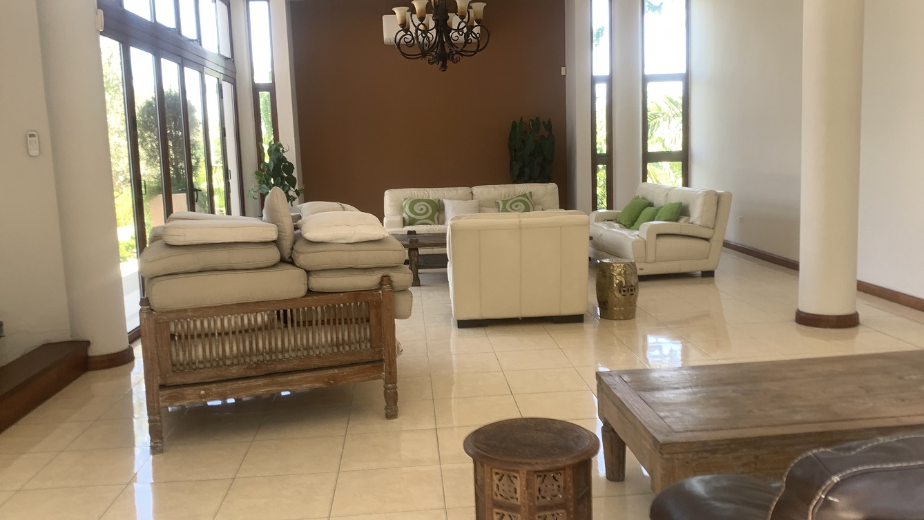 Lavish Furnished Paraseismic Mansion for Sale in Juvenat (Karibe Hotel Green Zone), Port-au-Prince, Haiti – 4 Spacious Bedrooms with Modern High-end Furniture & Appliances, Large Circular Living/Dining Rooms, 3 1/2 Stylish Bathrooms, Gourmet Kitchen, Panoramic Living/Dining Rooms, Gleaming Swimming Pool with Attached Jacuzzi, Multiple Seating Areas, Exclusive/Private Neighborhood, Robust 24/7 Solar-Powered Electricity System, Servant/Security Quarter