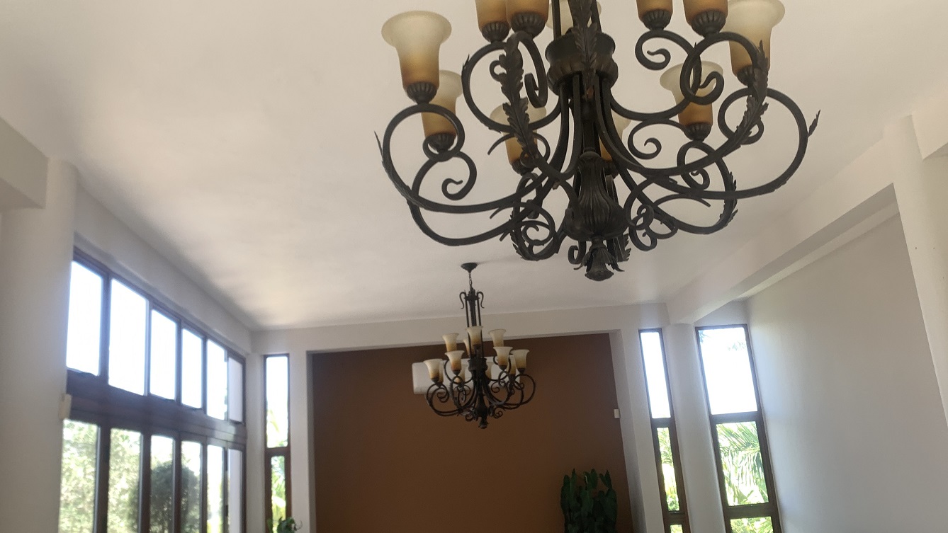 Lavish Furnished Paraseismic Mansion for Sale in Juvenat (Karibe Hotel Green Zone), Port-au-Prince, Haiti – 4 Spacious Bedrooms with Modern High-end Furniture & Appliances, Large Circular Living/Dining Rooms, 3 1/2 Stylish Bathrooms, Gourmet Kitchen, Panoramic Living/Dining Rooms, Gleaming Swimming Pool with Attached Jacuzzi, Multiple Seating Areas, Exclusive/Private Neighborhood, Robust 24/7 Solar-Powered Electricity System, Servant/Security Quarter