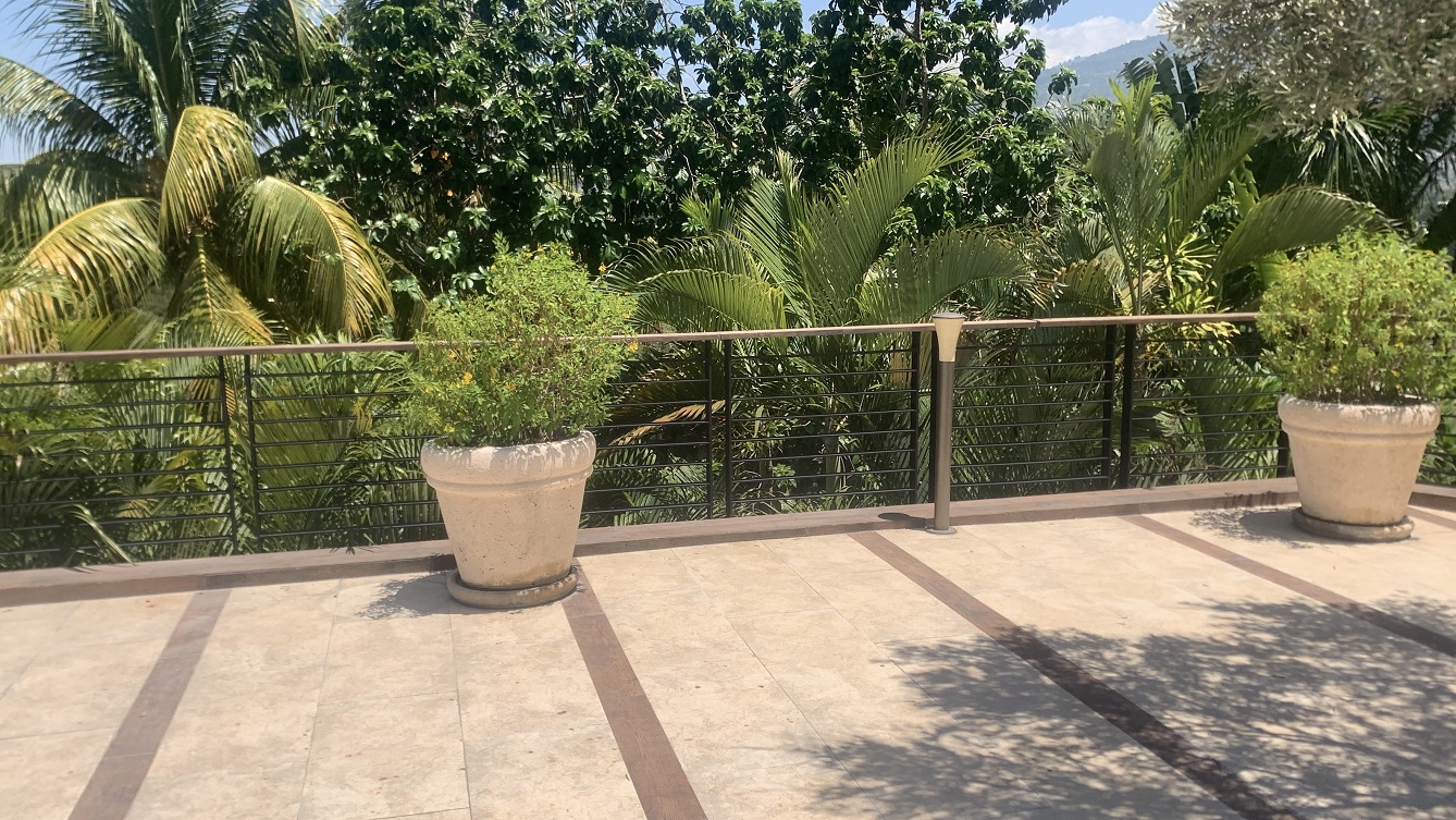 Lavish Furnished Paraseismic Mansion for Sale in Juvenat (Karibe Hotel Green Zone), Port-au-Prince, Haiti – 4 Spacious Bedrooms with Modern High-end Furniture & Appliances, Large Circular Living/Dining Rooms, 3 1/2 Stylish Bathrooms, Gourmet Kitchen, Panoramic Living/Dining Rooms, Gleaming Swimming Pool with Attached Jacuzzi, Multiple Seating Areas, Exclusive/Private Neighborhood, Robust 24/7 Solar-Powered Electricity System, Servant/Security Quarter