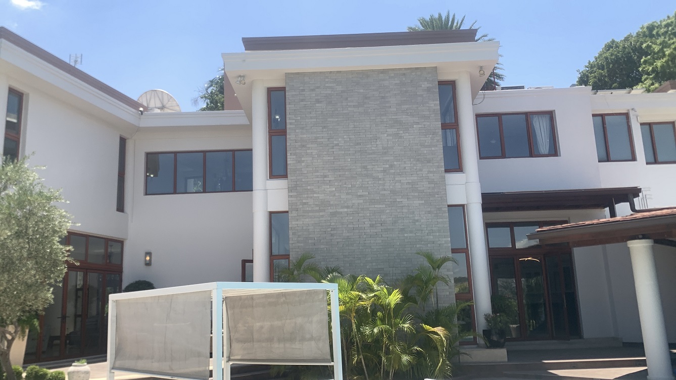 Lavish Furnished Paraseismic Mansion for Sale in Juvenat (Karibe Hotel Green Zone), Port-au-Prince, Haiti – 4 Spacious Bedrooms with Modern High-end Furniture & Appliances, Large Circular Living/Dining Rooms, 3 1/2 Stylish Bathrooms, Gourmet Kitchen, Panoramic Living/Dining Rooms, Gleaming Swimming Pool with Attached Jacuzzi, Multiple Seating Areas, Exclusive/Private Neighborhood, Robust 24/7 Solar-Powered Electricity System, Servant/Security Quarter