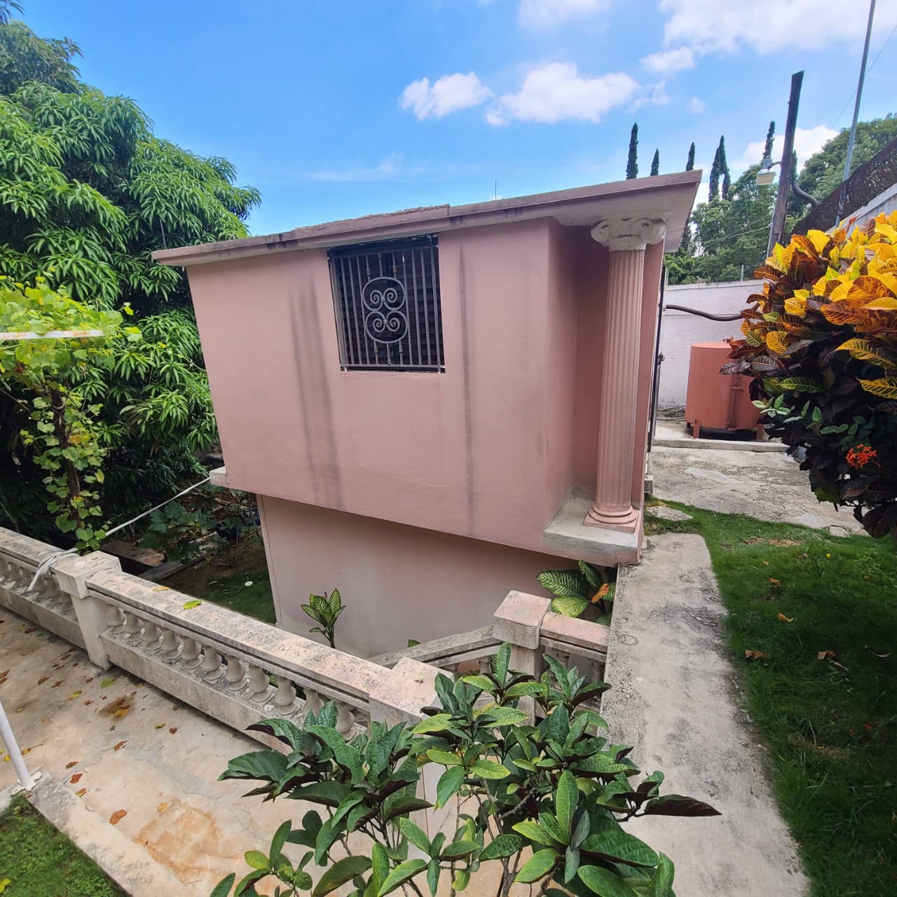 Stunning Furnished House for SALE in Lower Morne Calvaire, Petion-Ville, Haiti – 3 Spacious Bedrooms with Modern High-end Furniture & Appliances, Capacious Living/Dining Rooms, 3 1/2 Stylish Bathrooms, Gourmet Kitchen, Panoramic Living/Dining Rooms, Radiant Swimming Pool with Chairs, Chaise Loungers, & Tables, Multiple Seating Areas, Exclusive/Private Neighborhood, Robust 24/7 Solar-Powered Electricity System, Servant/Security Quarters, Manicure, Lush Green Trees