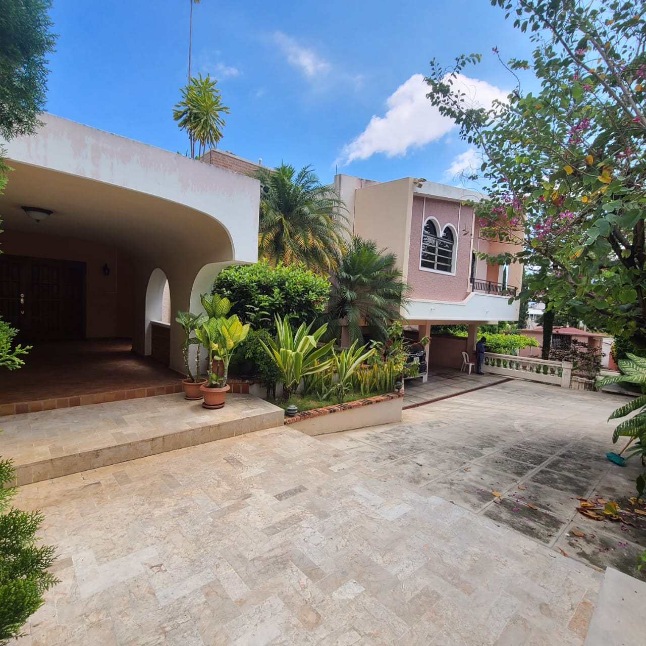 Stunning Furnished House for SALE in Lower Morne Calvaire, Petion-Ville, Haiti – 3 Spacious Bedrooms with Modern High-end Furniture & Appliances, Capacious Living/Dining Rooms, 3 1/2 Stylish Bathrooms, Gourmet Kitchen, Panoramic Living/Dining Rooms, Radiant Swimming Pool with Chairs, Chaise Loungers, & Tables, Multiple Seating Areas, Exclusive/Private Neighborhood, Robust 24/7 Solar-Powered Electricity System, Servant/Security Quarters, Manicure, Lush Green Trees