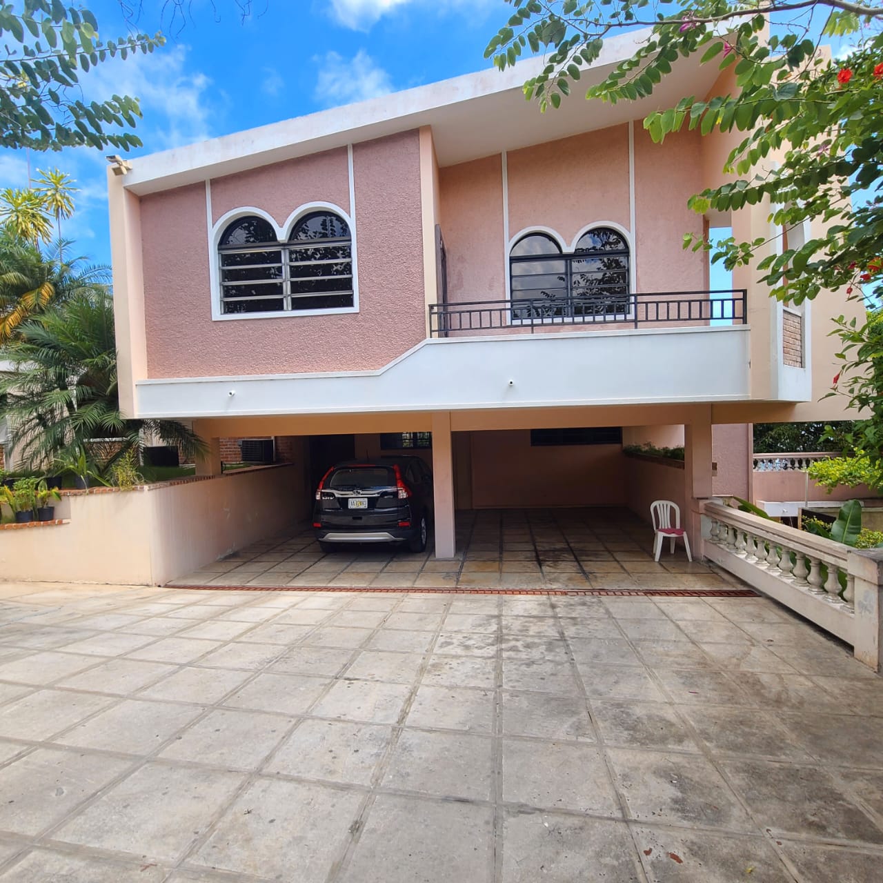 Stunning Furnished House for SALE in Lower Morne Calvaire, Petion-Ville, Haiti – 3 Spacious Bedrooms with Modern High-end Furniture & Appliances, Capacious Living/Dining Rooms, 3 1/2 Stylish Bathrooms, Gourmet Kitchen, Panoramic Living/Dining Rooms, Radiant Swimming Pool with Chairs, Chaise Loungers, & Tables, Multiple Seating Areas, Exclusive/Private Neighborhood, Robust 24/7 Solar-Powered Electricity System, Servant/Security Quarters, Manicure, Lush Green Trees