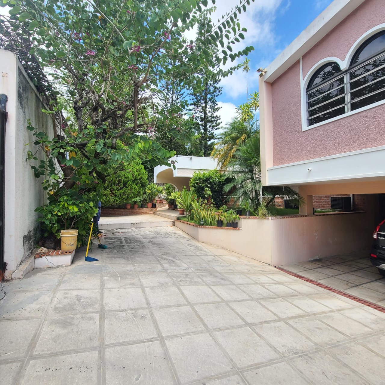 Stunning Furnished House for SALE in Lower Morne Calvaire, Petion-Ville, Haiti – 3 Spacious Bedrooms with Modern High-end Furniture & Appliances, Capacious Living/Dining Rooms, 3 1/2 Stylish Bathrooms, Gourmet Kitchen, Panoramic Living/Dining Rooms, Radiant Swimming Pool with Chairs, Chaise Loungers, & Tables, Multiple Seating Areas, Exclusive/Private Neighborhood, Robust 24/7 Solar-Powered Electricity System, Servant/Security Quarters, Manicure, Lush Green Trees