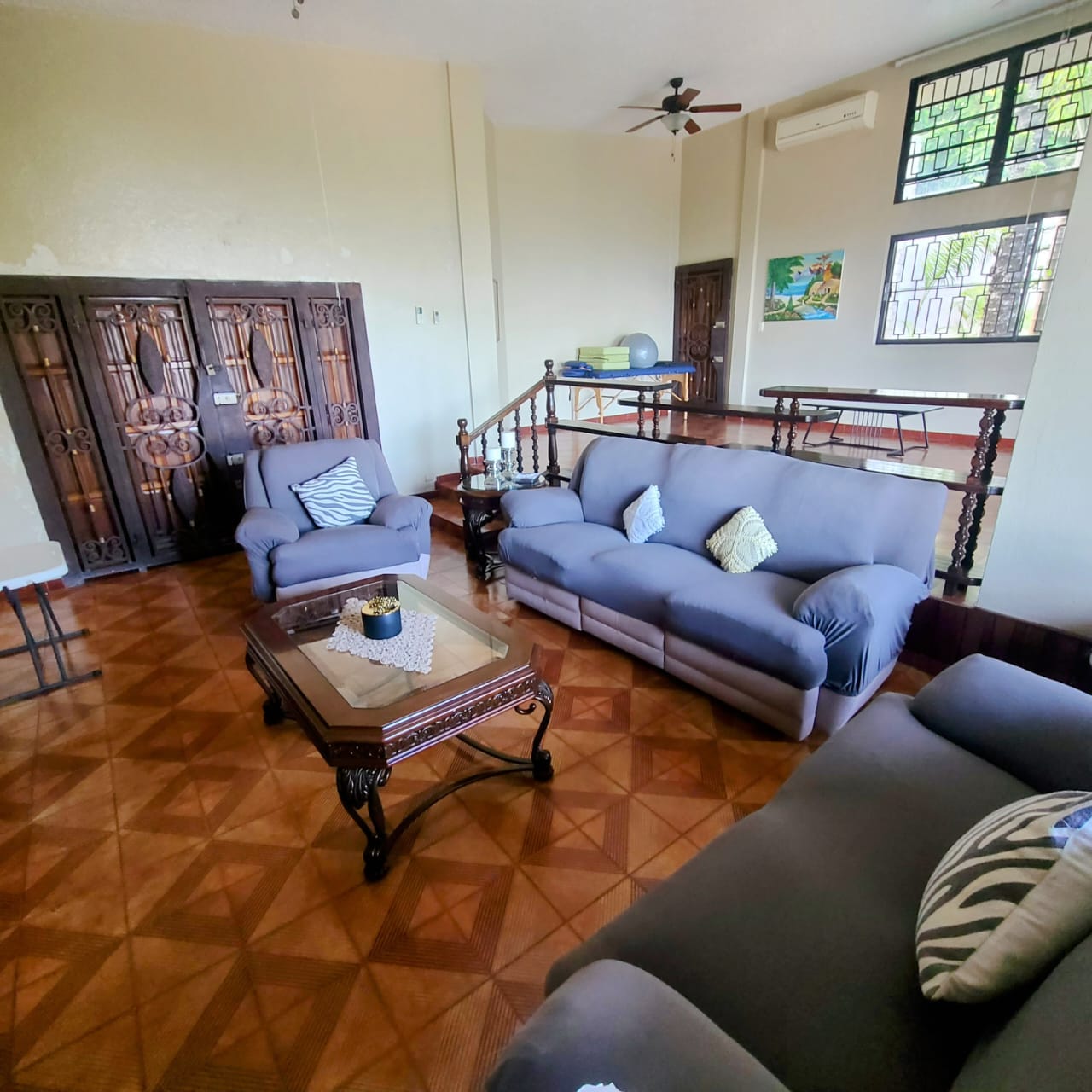 Stunning Furnished House for SALE in Lower Morne Calvaire, Petion-Ville, Haiti – 3 Spacious Bedrooms with Modern High-end Furniture & Appliances, Capacious Living/Dining Rooms, 3 1/2 Stylish Bathrooms, Gourmet Kitchen, Panoramic Living/Dining Rooms, Radiant Swimming Pool with Chairs, Chaise Loungers, & Tables, Multiple Seating Areas, Exclusive/Private Neighborhood, Robust 24/7 Solar-Powered Electricity System, Servant/Security Quarters, Manicure, Lush Green Trees