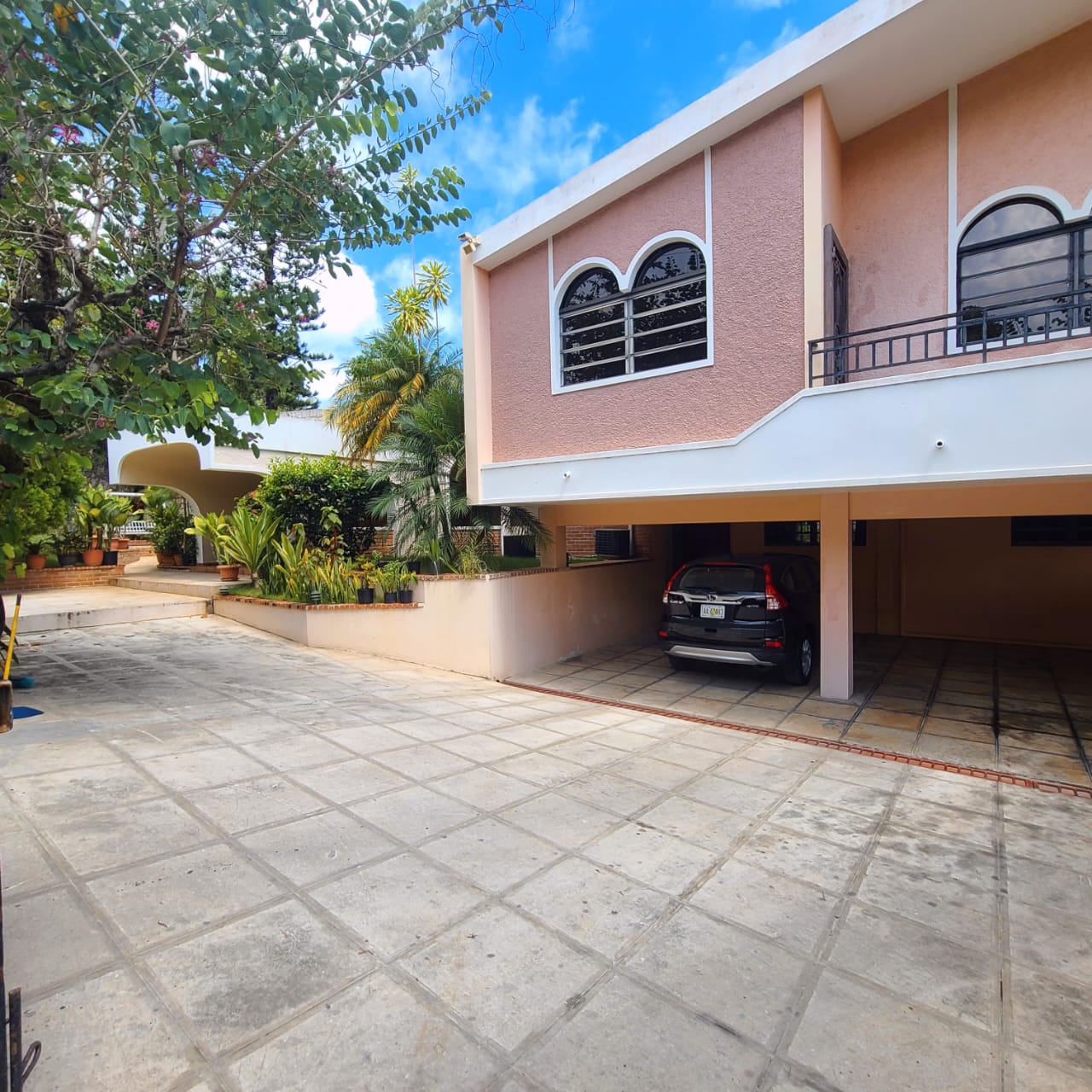 Stunning Furnished House for SALE in Lower Morne Calvaire, Petion-Ville, Haiti – 3 Spacious Bedrooms with Modern High-end Furniture & Appliances, Capacious Living/Dining Rooms, 3 1/2 Stylish Bathrooms, Gourmet Kitchen, Panoramic Living/Dining Rooms, Radiant Swimming Pool with Chairs, Chaise Loungers, & Tables, Multiple Seating Areas, Exclusive/Private Neighborhood, Robust 24/7 Solar-Powered Electricity System, Servant/Security Quarters, Manicure, Lush Green Trees