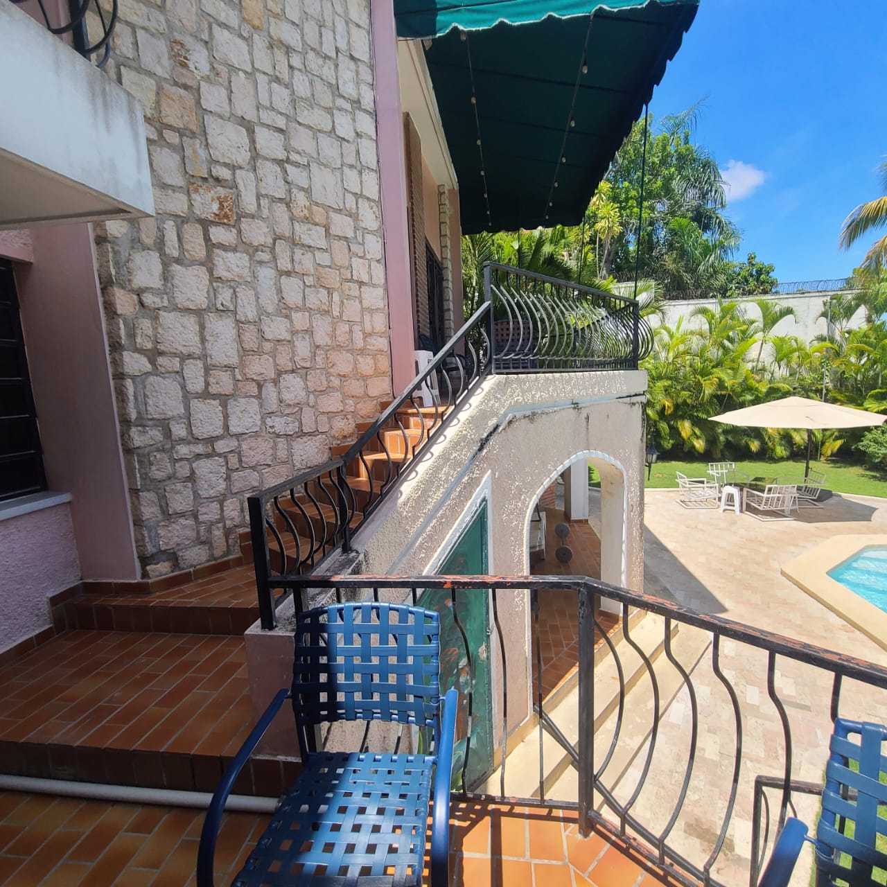 Stunning Furnished House for SALE in Lower Morne Calvaire, Petion-Ville, Haiti – 3 Spacious Bedrooms with Modern High-end Furniture & Appliances, Capacious Living/Dining Rooms, 3 1/2 Stylish Bathrooms, Gourmet Kitchen, Panoramic Living/Dining Rooms, Radiant Swimming Pool with Chairs, Chaise Loungers, & Tables, Multiple Seating Areas, Exclusive/Private Neighborhood, Robust 24/7 Solar-Powered Electricity System, Servant/Security Quarters, Manicure, Lush Green Trees