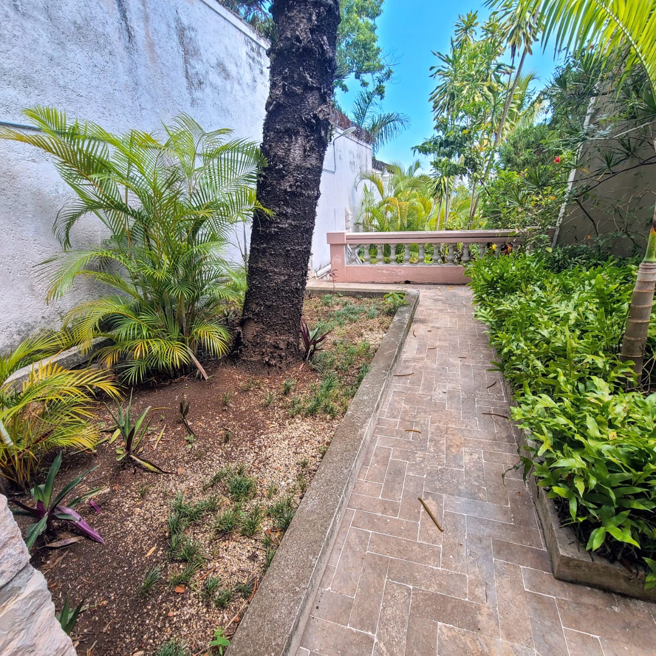 Stunning Furnished House for SALE in Lower Morne Calvaire, Petion-Ville, Haiti – 3 Spacious Bedrooms with Modern High-end Furniture & Appliances, Capacious Living/Dining Rooms, 3 1/2 Stylish Bathrooms, Gourmet Kitchen, Panoramic Living/Dining Rooms, Radiant Swimming Pool with Chairs, Chaise Loungers, & Tables, Multiple Seating Areas, Exclusive/Private Neighborhood, Robust 24/7 Solar-Powered Electricity System, Servant/Security Quarters, Manicure, Lush Green Trees