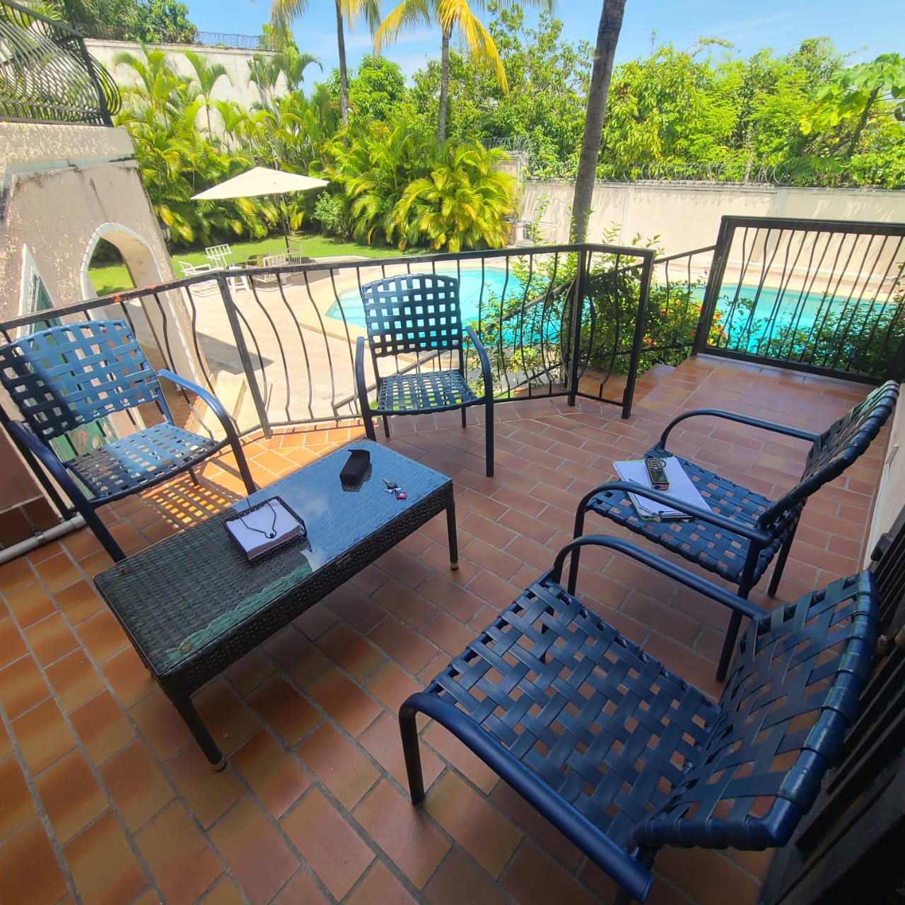 Stunning Furnished House for SALE in Lower Morne Calvaire, Petion-Ville, Haiti – 3 Spacious Bedrooms with Modern High-end Furniture & Appliances, Capacious Living/Dining Rooms, 3 1/2 Stylish Bathrooms, Gourmet Kitchen, Panoramic Living/Dining Rooms, Radiant Swimming Pool with Chairs, Chaise Loungers, & Tables, Multiple Seating Areas, Exclusive/Private Neighborhood, Robust 24/7 Solar-Powered Electricity System, Servant/Security Quarters, Manicure, Lush Green Trees