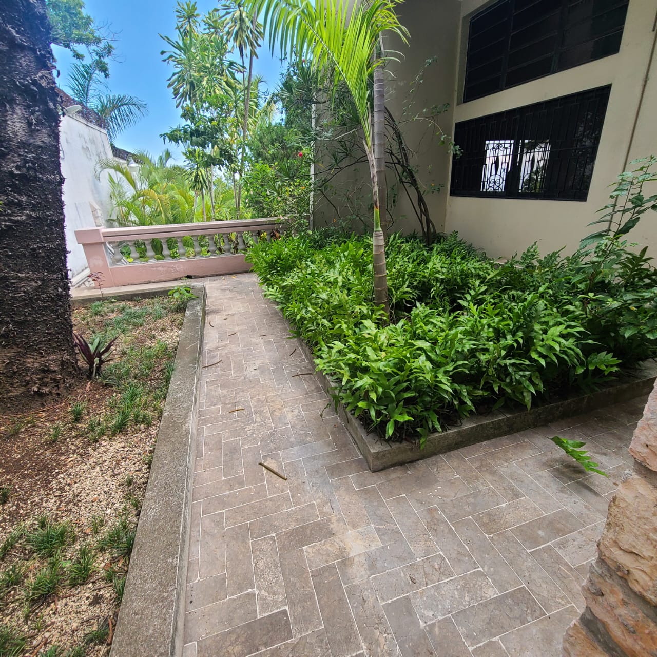 Stunning Furnished House for SALE in Lower Morne Calvaire, Petion-Ville, Haiti – 3 Spacious Bedrooms with Modern High-end Furniture & Appliances, Capacious Living/Dining Rooms, 3 1/2 Stylish Bathrooms, Gourmet Kitchen, Panoramic Living/Dining Rooms, Radiant Swimming Pool with Chairs, Chaise Loungers, & Tables, Multiple Seating Areas, Exclusive/Private Neighborhood, Robust 24/7 Solar-Powered Electricity System, Servant/Security Quarters, Manicure, Lush Green Trees