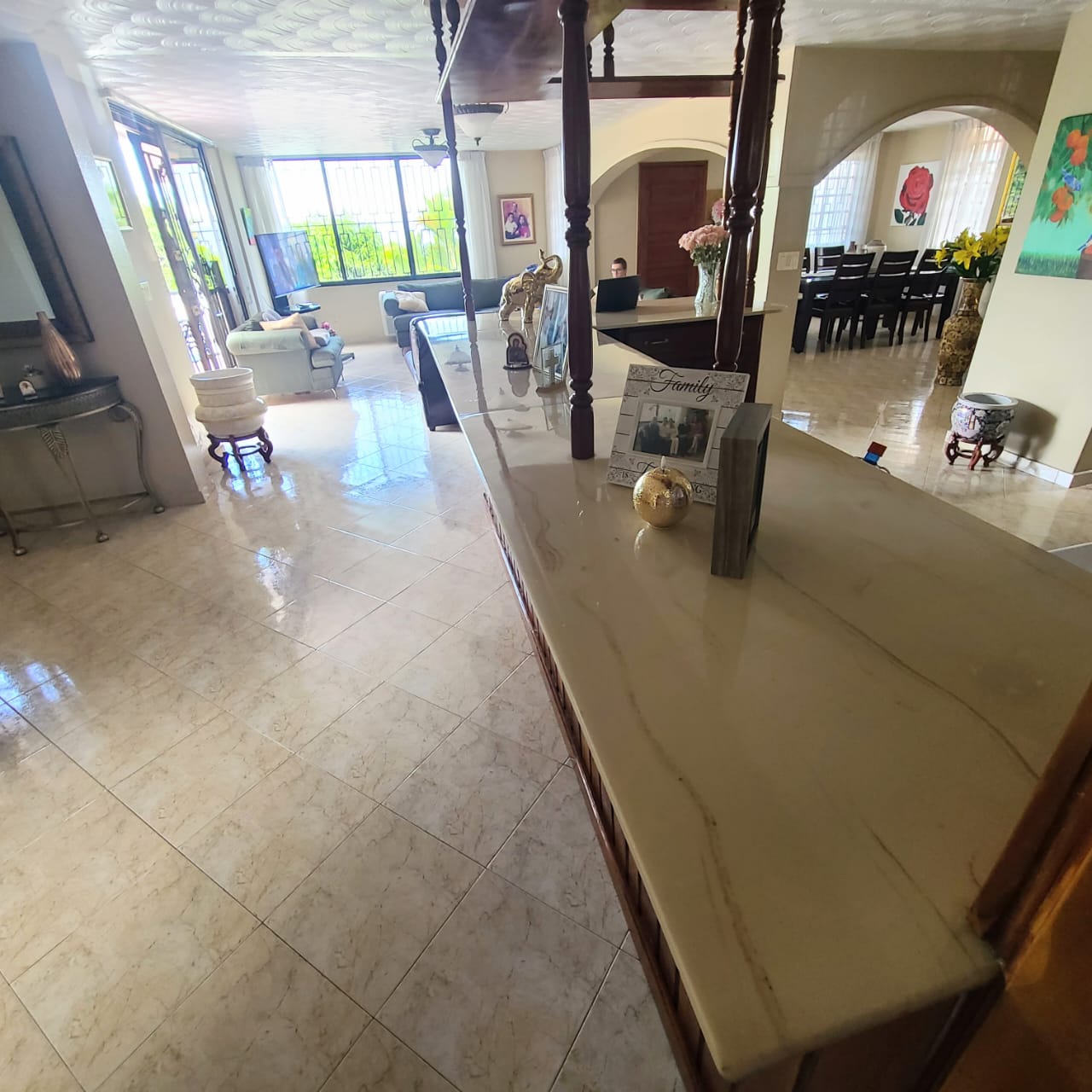 Stunning Furnished House for SALE in Lower Morne Calvaire, Petion-Ville, Haiti – 3 Spacious Bedrooms with Modern High-end Furniture & Appliances, Capacious Living/Dining Rooms, 3 1/2 Stylish Bathrooms, Gourmet Kitchen, Panoramic Living/Dining Rooms, Radiant Swimming Pool with Chairs, Chaise Loungers, & Tables, Multiple Seating Areas, Exclusive/Private Neighborhood, Robust 24/7 Solar-Powered Electricity System, Servant/Security Quarters, Manicure, Lush Green Trees