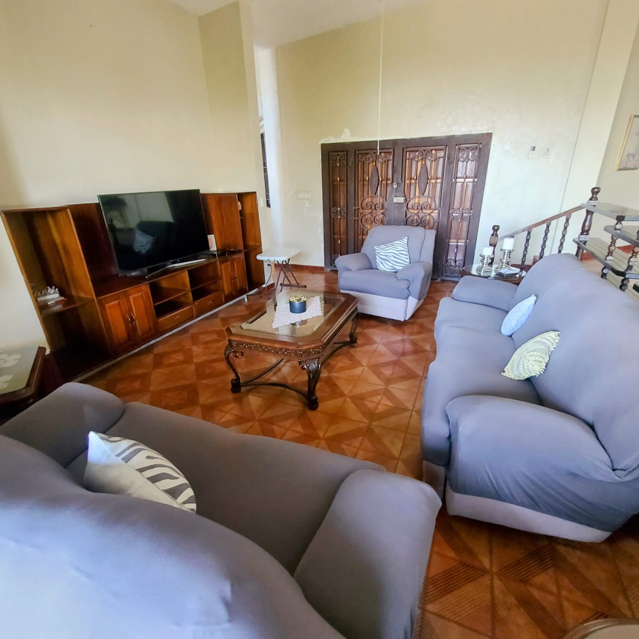 Stunning Furnished House for SALE in Lower Morne Calvaire, Petion-Ville, Haiti – 3 Spacious Bedrooms with Modern High-end Furniture & Appliances, Capacious Living/Dining Rooms, 3 1/2 Stylish Bathrooms, Gourmet Kitchen, Panoramic Living/Dining Rooms, Radiant Swimming Pool with Chairs, Chaise Loungers, & Tables, Multiple Seating Areas, Exclusive/Private Neighborhood, Robust 24/7 Solar-Powered Electricity System, Servant/Security Quarters, Manicure, Lush Green Trees