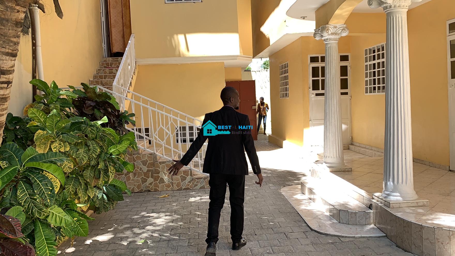 Beautiful, 3-Story, Mega Furnished House For Sale in Santo 17, Port-au-Prince, Haiti – 8 Spacious Bedrooms with Walk-in Closets, 7 Bathrooms, Multiple Living & Dining Rooms, Modern Kitchen, Floor-to-Ceiling Windows, Several Balconies, Servant Quarters, Big Yards/Gardens, 80-foot Artesian Well, High Fences, 2 Iron Gates, Lots of Parking Spaces