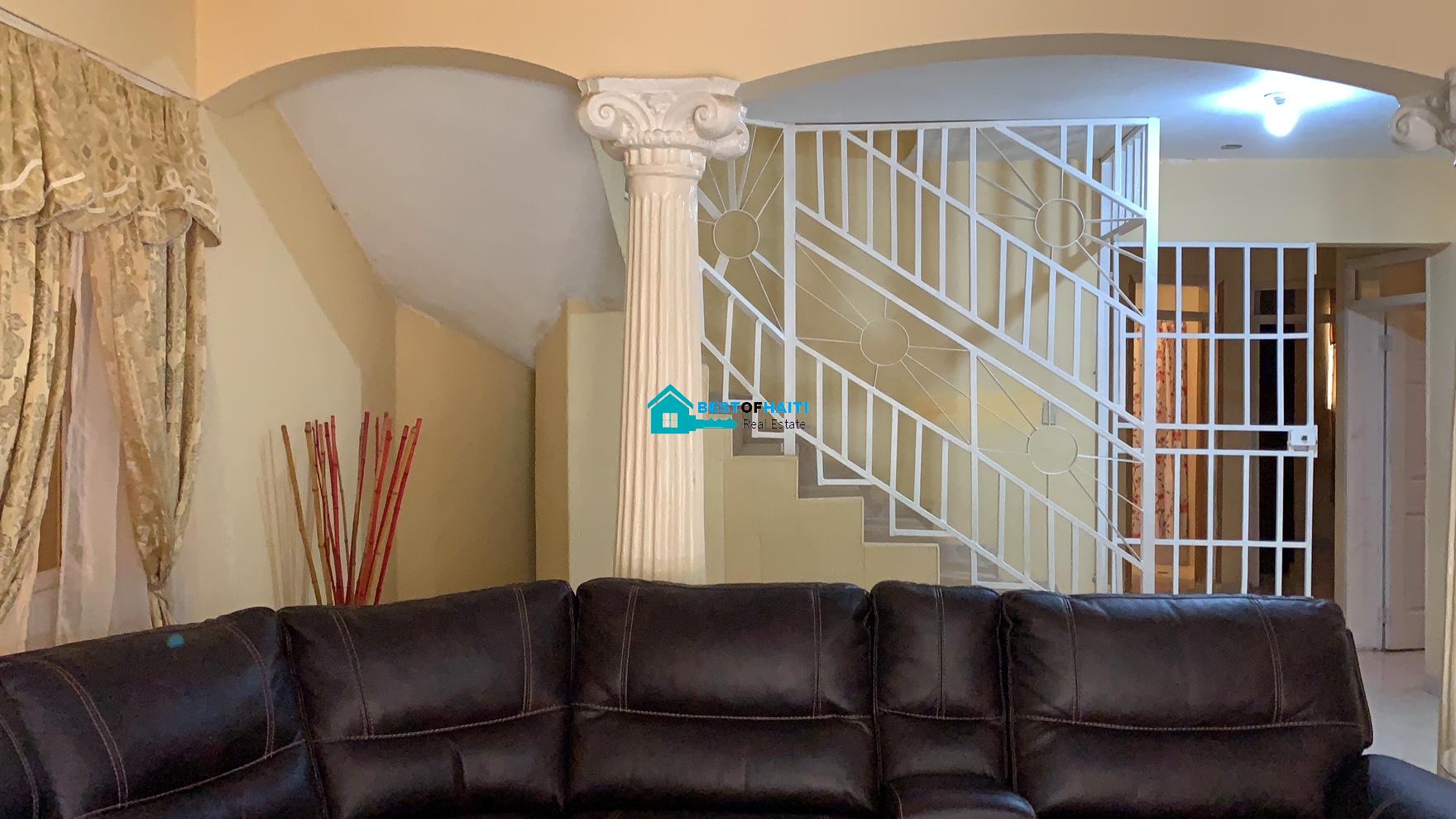 Beautiful, 3-Story, Mega Furnished House For Sale in Santo 17, Port-au-Prince, Haiti – 8 Spacious Bedrooms with Walk-in Closets, 7 Bathrooms, Multiple Living & Dining Rooms, Modern Kitchen, Floor-to-Ceiling Windows, Several Balconies, Servant Quarters, Big Yards/Gardens, 80-foot Artesian Well, High Fences, 2 Iron Gates, Lots of Parking Spaces
