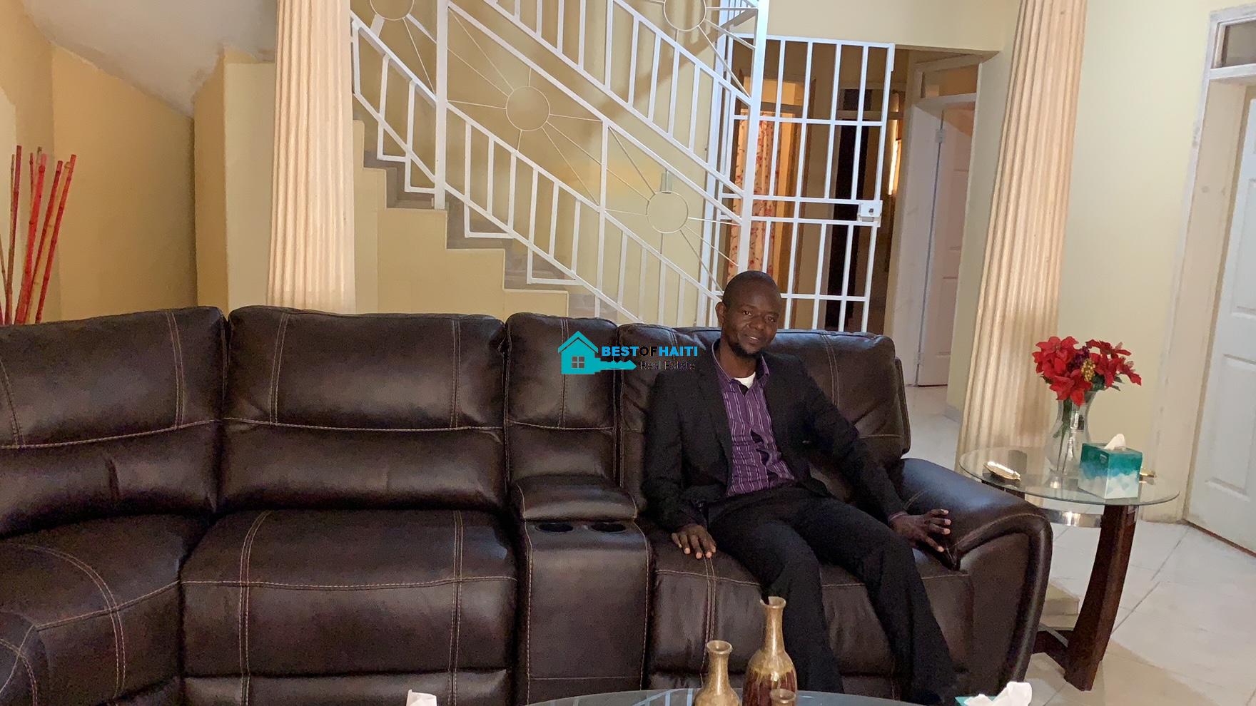 Beautiful, 3-Story, Mega Furnished House For Sale in Santo 17, Port-au-Prince, Haiti – 8 Spacious Bedrooms with Walk-in Closets, 7 Bathrooms, Multiple Living & Dining Rooms, Modern Kitchen, Floor-to-Ceiling Windows, Several Balconies, Servant Quarters, Big Yards/Gardens, 80-foot Artesian Well, High Fences, 2 Iron Gates, Lots of Parking Spaces