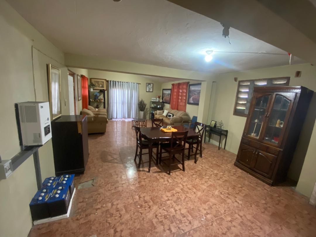 Move-in Ready Furnished Apartment for RENT in Petite Anse, Cap-Haïtien, Haiti – 2 Bedrooms, 1 Bathroom, Living/Dining Rooms with Clean Furniture & Appliances, Modern Kitchen, Large Upper Balcony with Views, Fans, Washer/Dryer, High-Speed Internet, Television (TV), Solar-Powered Electricity, Indoor Parking for 1 Car