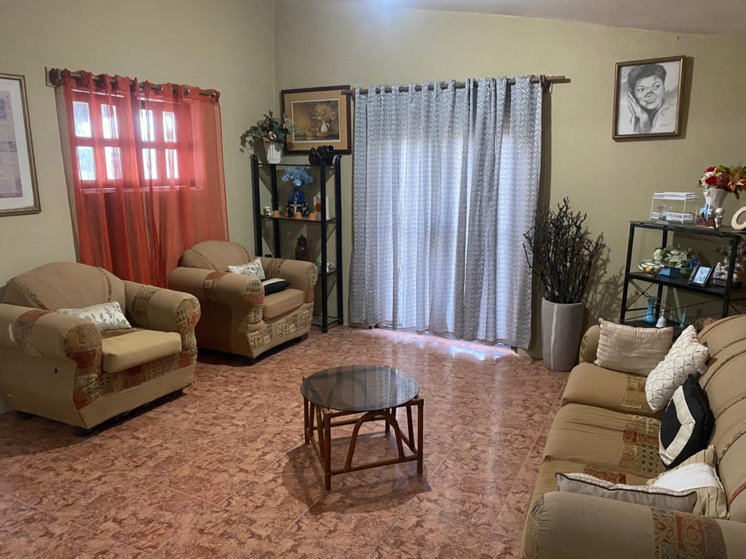 Move-in Ready Furnished Apartment for RENT in Petite Anse, Cap-Haïtien, Haiti – 2 Bedrooms, 1 Bathroom, Living/Dining Rooms with Clean Furniture & Appliances, Modern Kitchen, Large Upper Balcony with Views, Fans, Washer/Dryer, High-Speed Internet, Television (TV), Solar-Powered Electricity, Indoor Parking for 1 Car