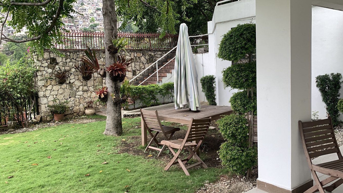 Newly Renovated FURNISHED MEGA LUXURY HOUSE for SALE, Juvenat (Yards from Karibe Hotel), Petion-Ville, Haiti – 4 Spacious Bedrooms, 3 1/2 Baths, Brand New Modern Furniture & Appliances,  Contemporary Island Kitchen, Manicured Backyard, Space for Sparkling Swimming Pool, 24/7 Robust Solar-Powered Electricity, Backup Generator, Security Guards on Rotation, WiFi/Internet, Servant Quarter, 10+ Parking Spaces, Lots of Greenery, Fruit, Vegetable, Tropical Trees, and More…