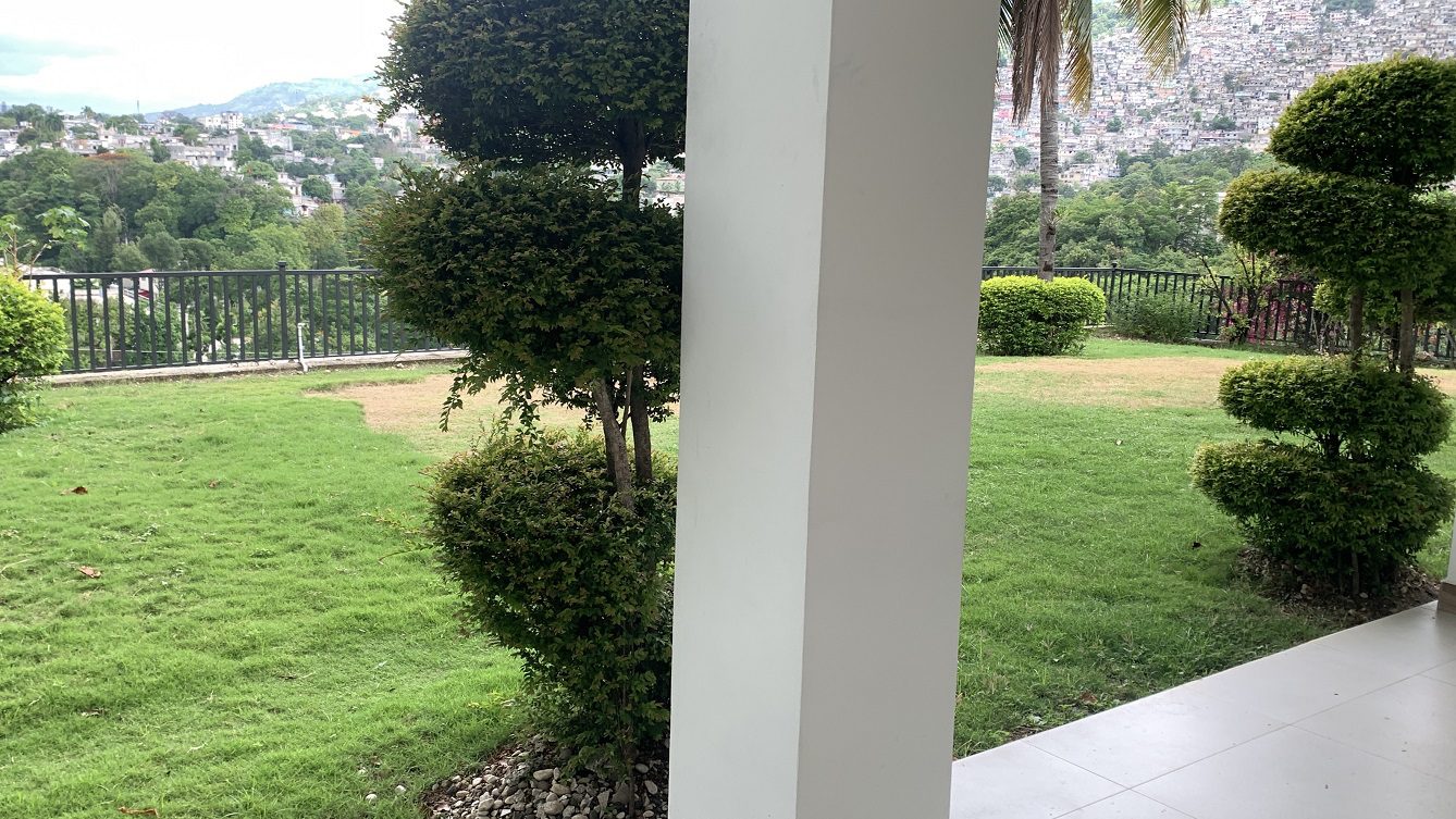 Newly Renovated FURNISHED MEGA LUXURY HOUSE for SALE, Juvenat (Yards from Karibe Hotel), Petion-Ville, Haiti – 4 Spacious Bedrooms, 3 1/2 Baths, Brand New Modern Furniture & Appliances,  Contemporary Island Kitchen, Manicured Backyard, Space for Sparkling Swimming Pool, 24/7 Robust Solar-Powered Electricity, Backup Generator, Security Guards on Rotation, WiFi/Internet, Servant Quarter, 10+ Parking Spaces, Lots of Greenery, Fruit, Vegetable, Tropical Trees, and More…