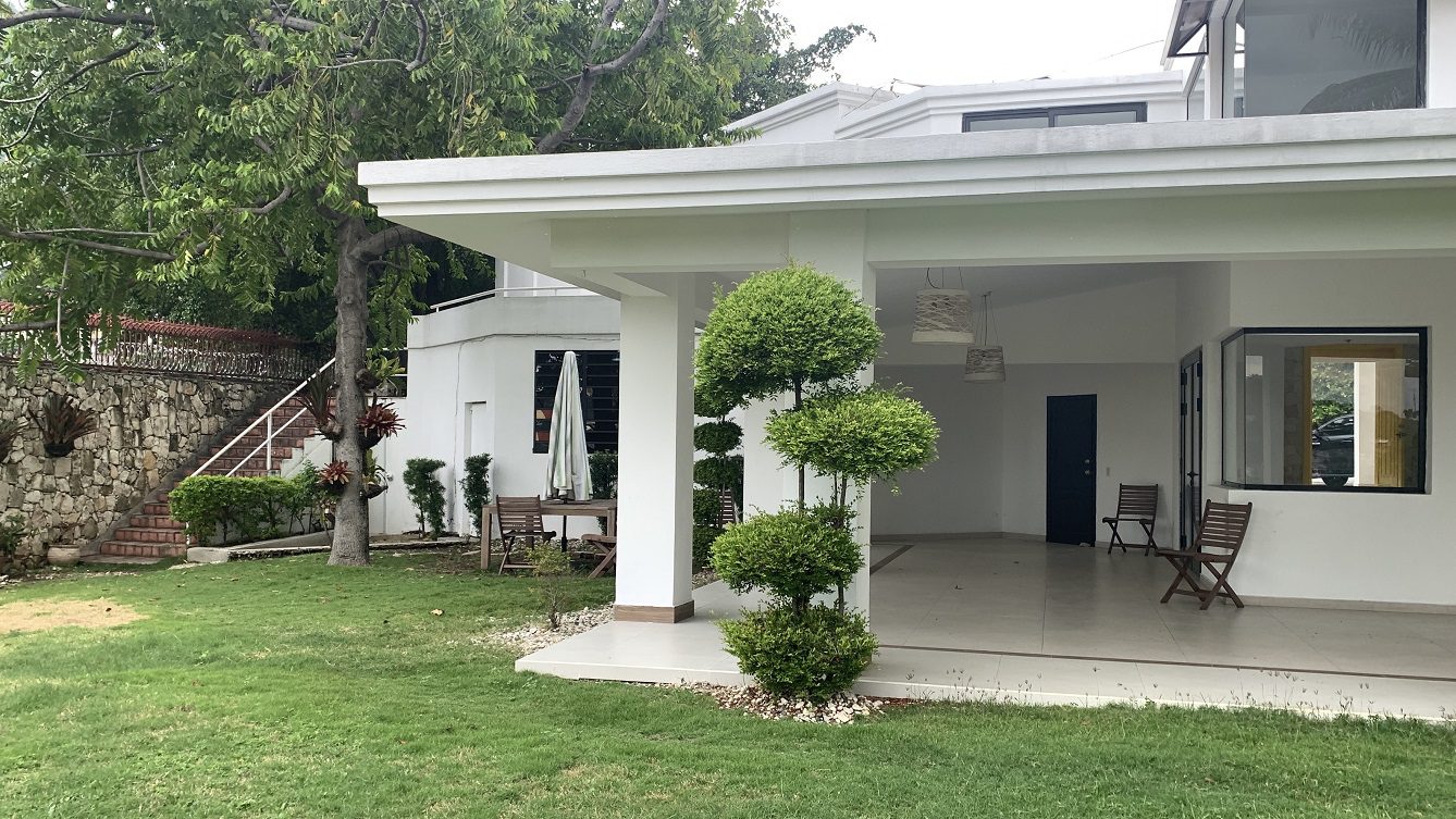 Newly Renovated FURNISHED MEGA LUXURY HOUSE for SALE, Juvenat (Yards from Karibe Hotel), Petion-Ville, Haiti – 4 Spacious Bedrooms, 3 1/2 Baths, Brand New Modern Furniture & Appliances,  Contemporary Island Kitchen, Manicured Backyard, Space for Sparkling Swimming Pool, 24/7 Robust Solar-Powered Electricity, Backup Generator, Security Guards on Rotation, WiFi/Internet, Servant Quarter, 10+ Parking Spaces, Lots of Greenery, Fruit, Vegetable, Tropical Trees, and More…