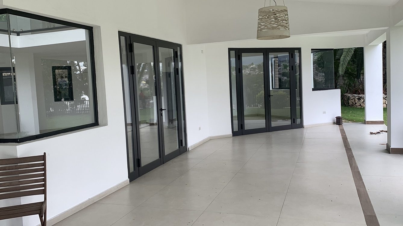 Newly Renovated FURNISHED MEGA LUXURY HOUSE for SALE, Juvenat (Yards from Karibe Hotel), Petion-Ville, Haiti – 4 Spacious Bedrooms, 3 1/2 Baths, Brand New Modern Furniture & Appliances,  Contemporary Island Kitchen, Manicured Backyard, Space for Sparkling Swimming Pool, 24/7 Robust Solar-Powered Electricity, Backup Generator, Security Guards on Rotation, WiFi/Internet, Servant Quarter, 10+ Parking Spaces, Lots of Greenery, Fruit, Vegetable, Tropical Trees, and More…