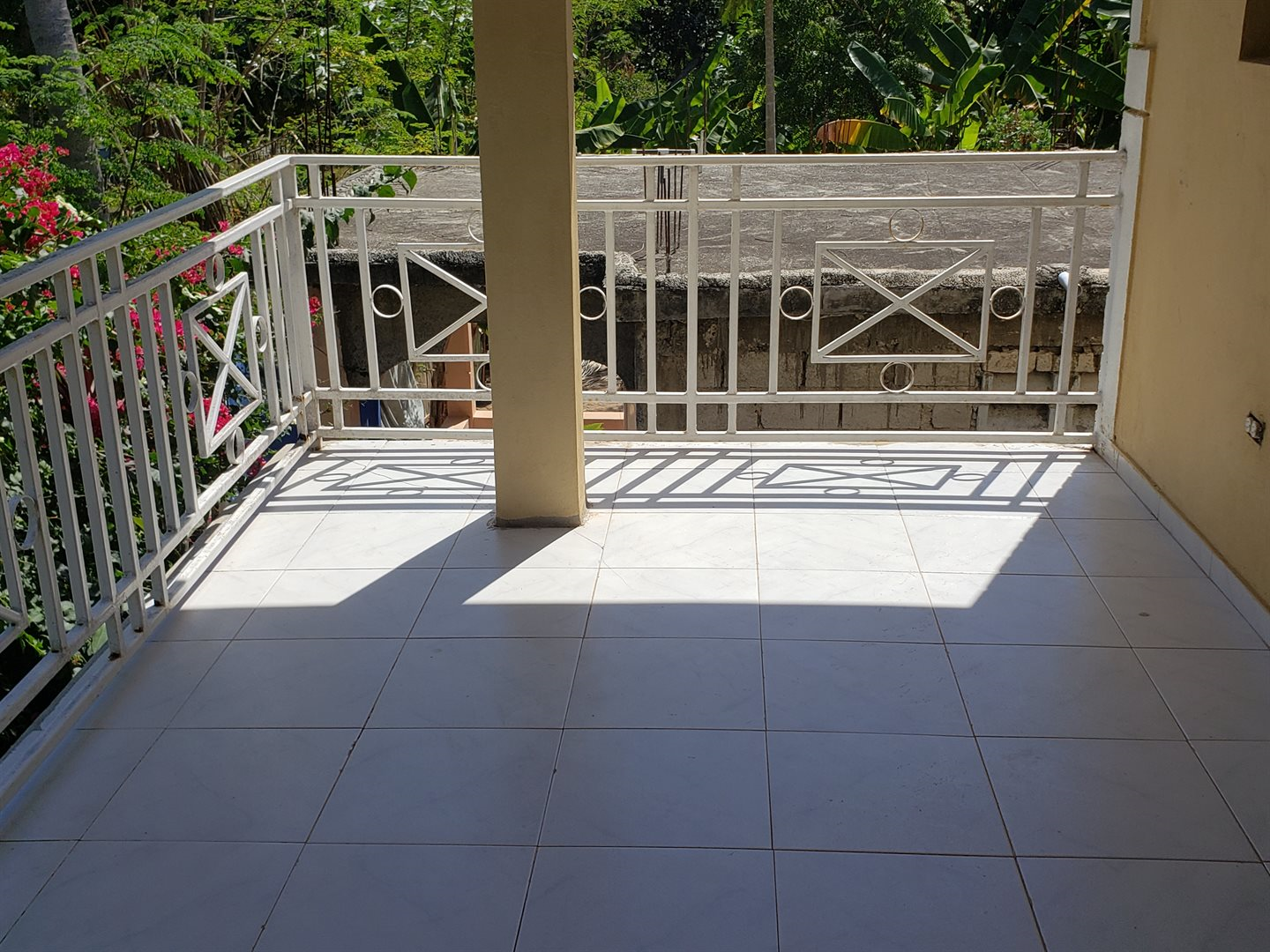 Two-Story House + Apartment + Land for Sale (PACKAGE DEAL) in Meyer, Jacmel, Haiti – 4 Spacious Bedrooms with Built-in Closets, 3 Bathrooms with Glamorous Bathtubs, Living/Dining Rooms, Nice Modern Kitchen, Wrap-Around Patio with Beautiful Flowers, Two Balconies, Family Room, Upstairs Loft, Solar-Powered Electricity System, Panoramic Views – An Apartment of 2 Bedrooms, 1 Bath, Kitchen – Piece of Land of 5 Centiemes (650 m² or 6996.54 ft²)